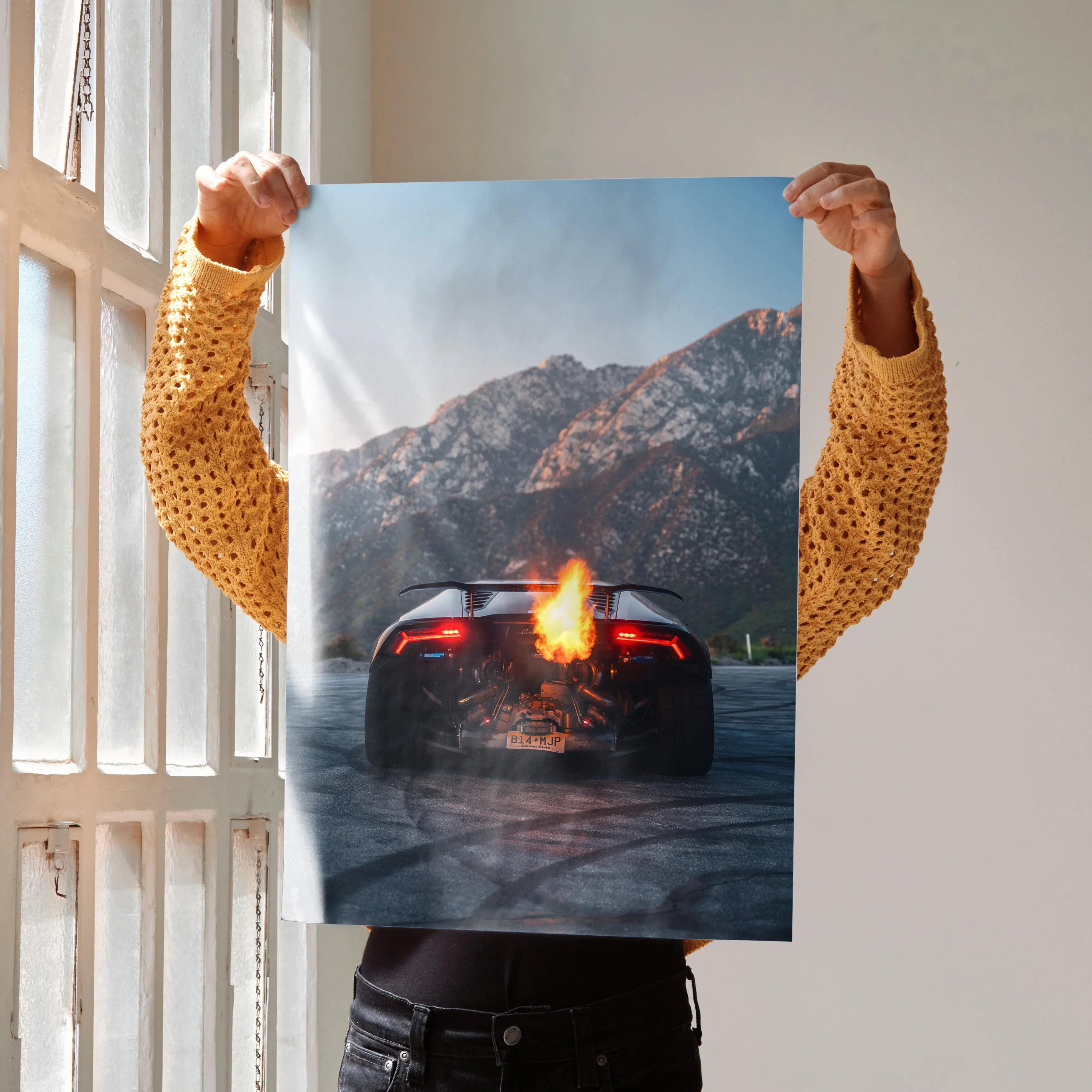 Lamborghini Huracan poster with fiery flames and mountainous background wall art.