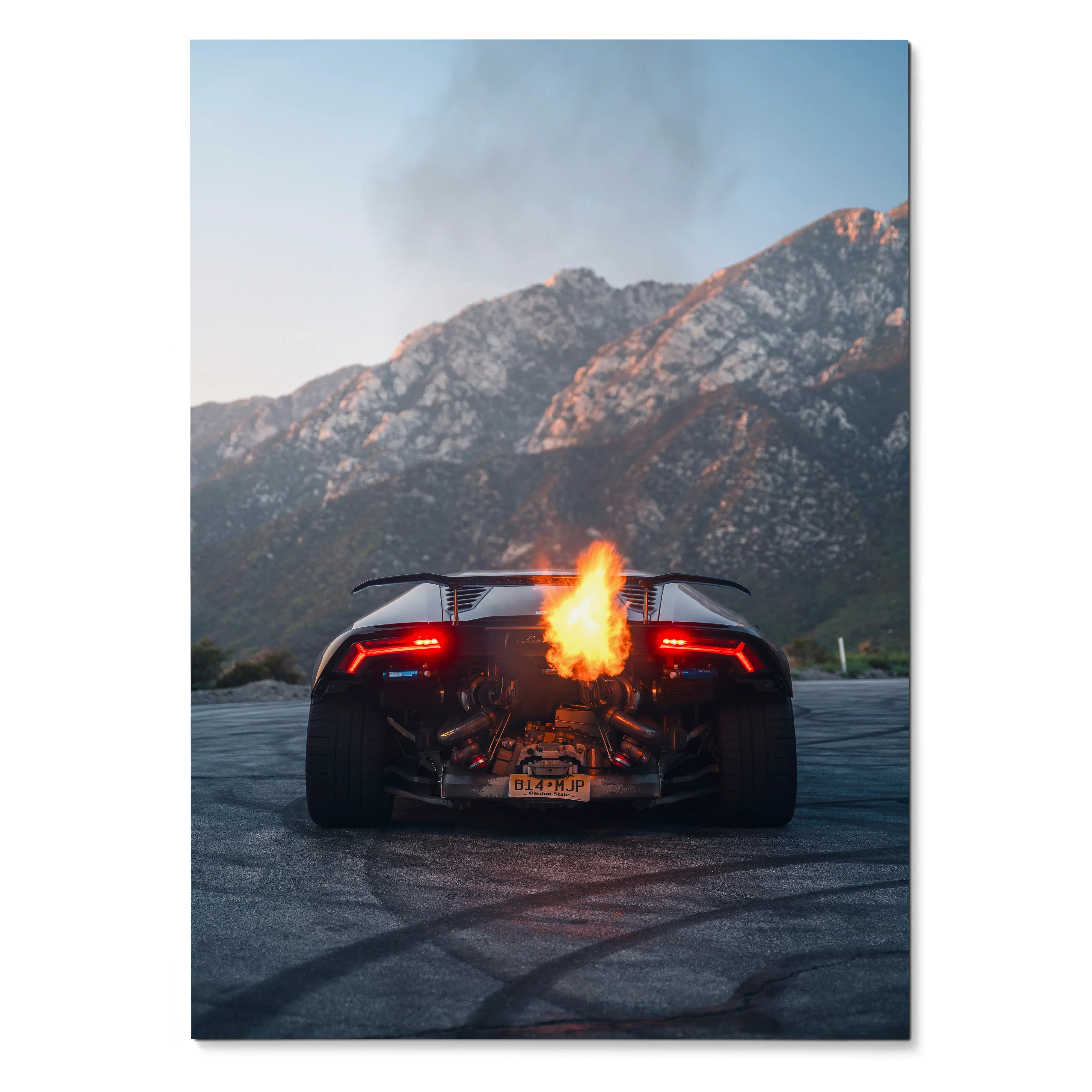 Lamborghini Huracan rear view with fiery flames and mountain background poster wall art.