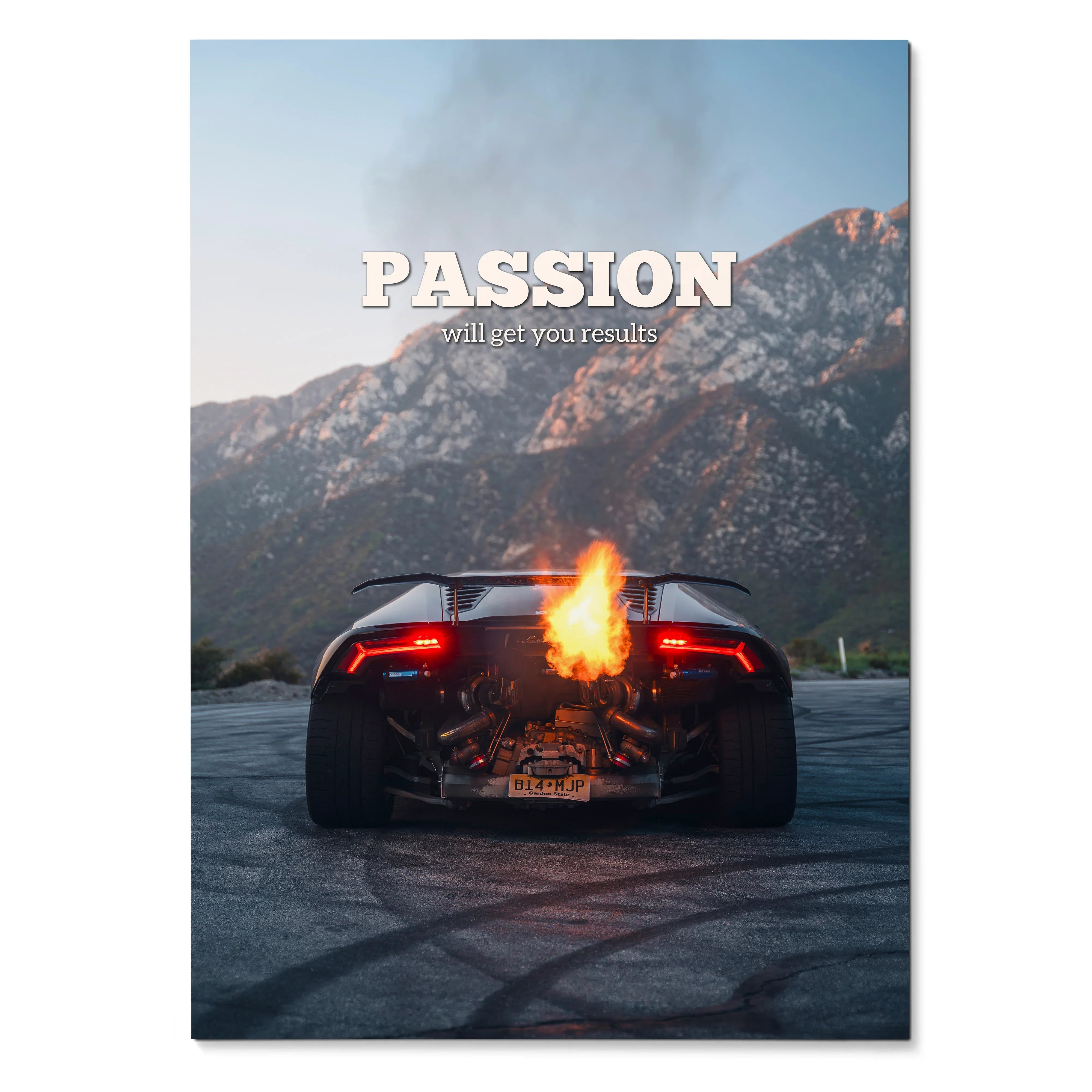 Motivational poster wall art featuring a black Lamborghini Huracan with flames from exhaust against mountain backdrop.