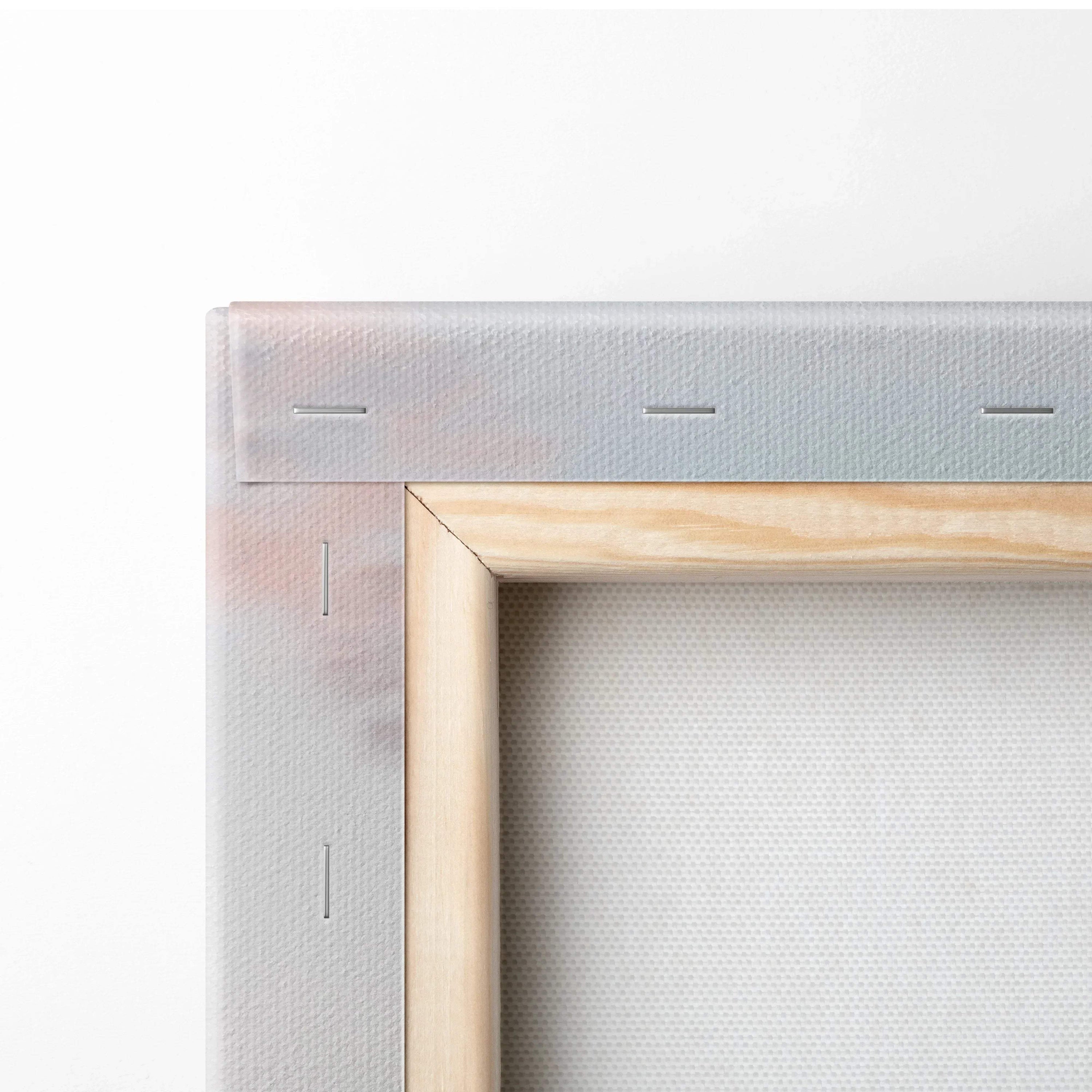 Close-up of wooden stretcher bars and stapled canvas edges for vertical wall art canvas print.