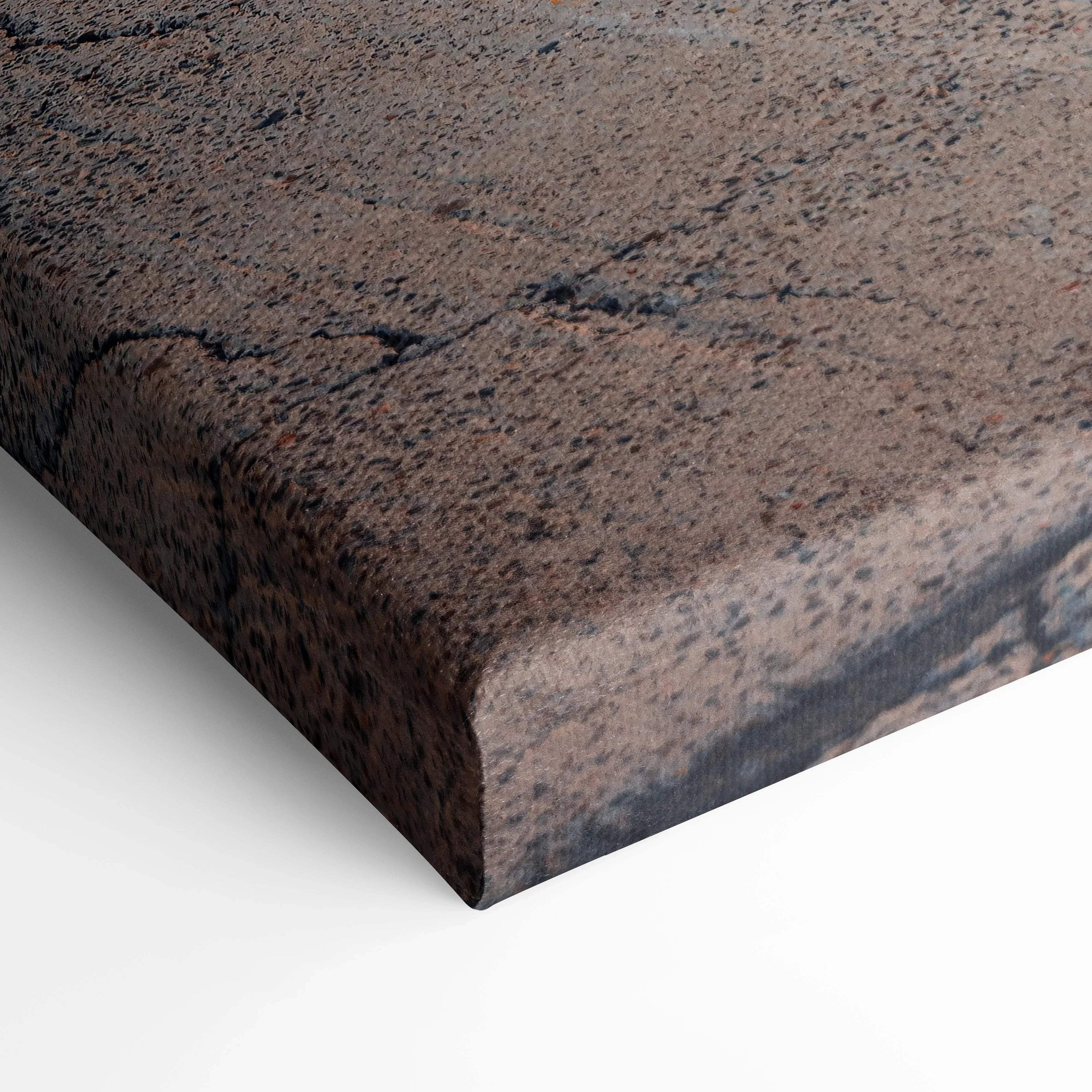 Close-up of textured canvas art with brown and black abstract design on gallery-wrapped wall art.