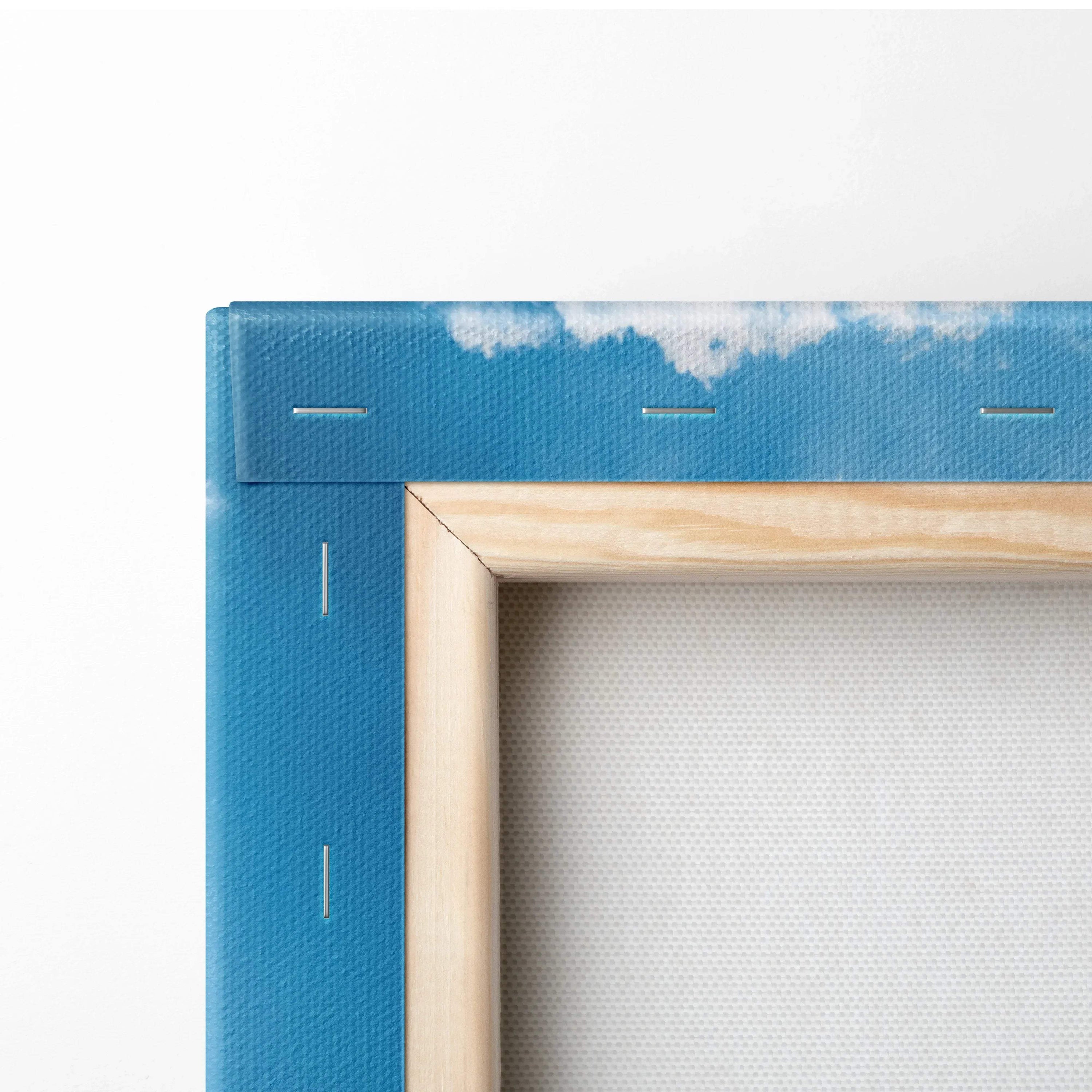 Close-up of corner wooden frame and stapled blue canvas art for wall art display.