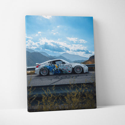 Nissan 370z with graffiti art on body parked on mountain road vertical canvas wall art.