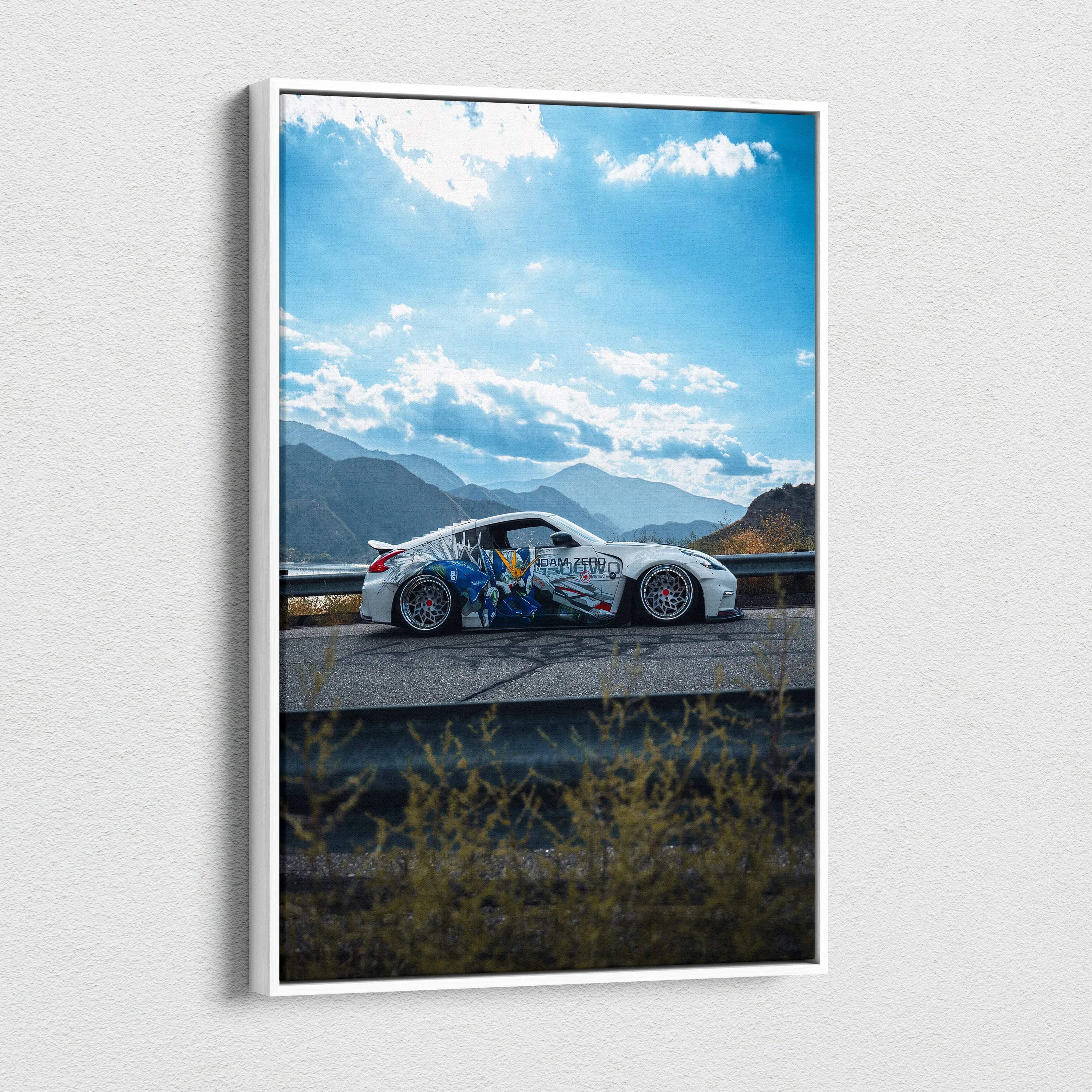 Vertical canvas wall art featuring a white Nissan 370z with colorful decals against a mountainous sky background.