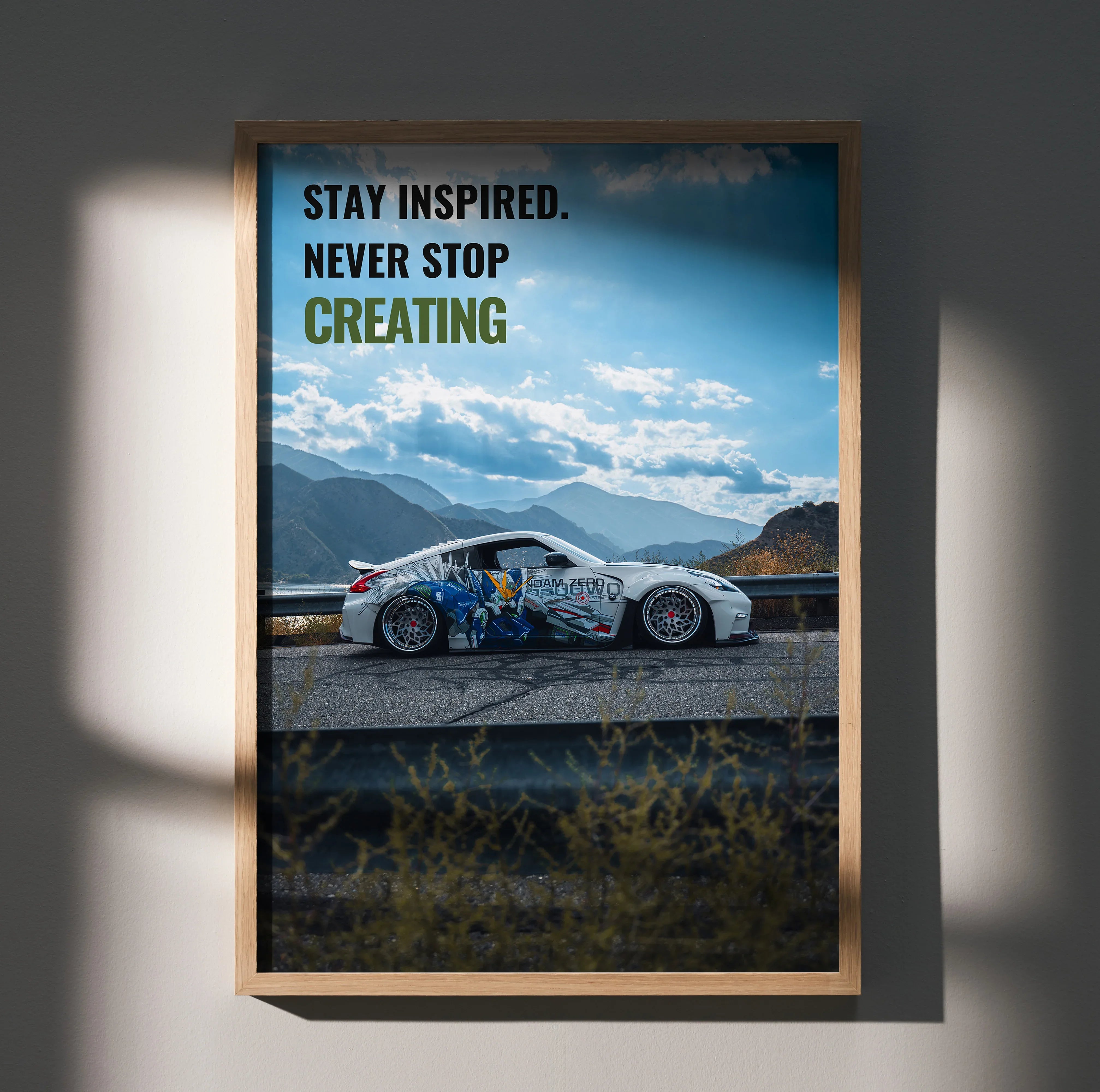 Nissan 370z on mountain road with motivational text, framed poster wall art.