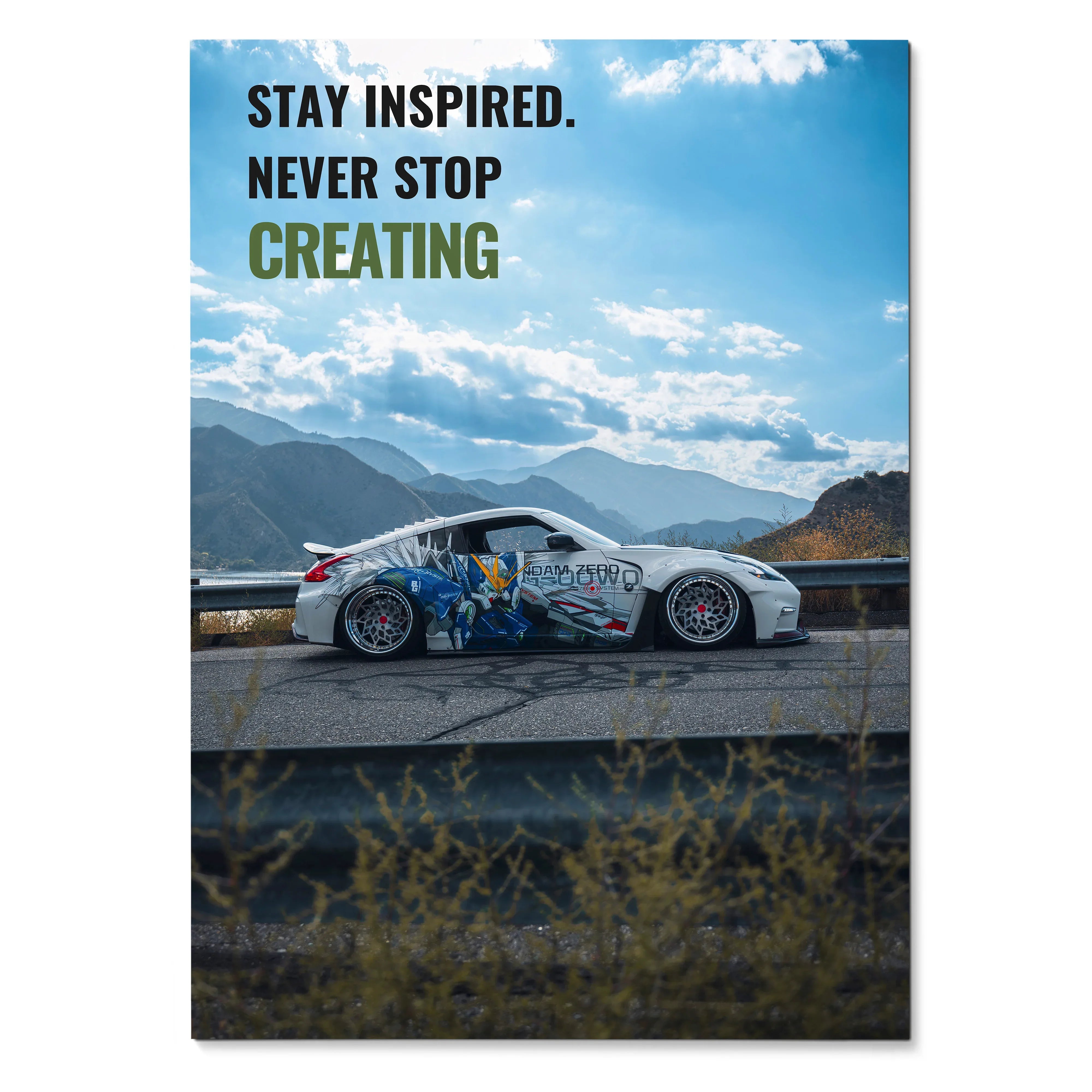Motivational poster wall art featuring a Nissan 370z with inspiring text over a mountain landscape sky.