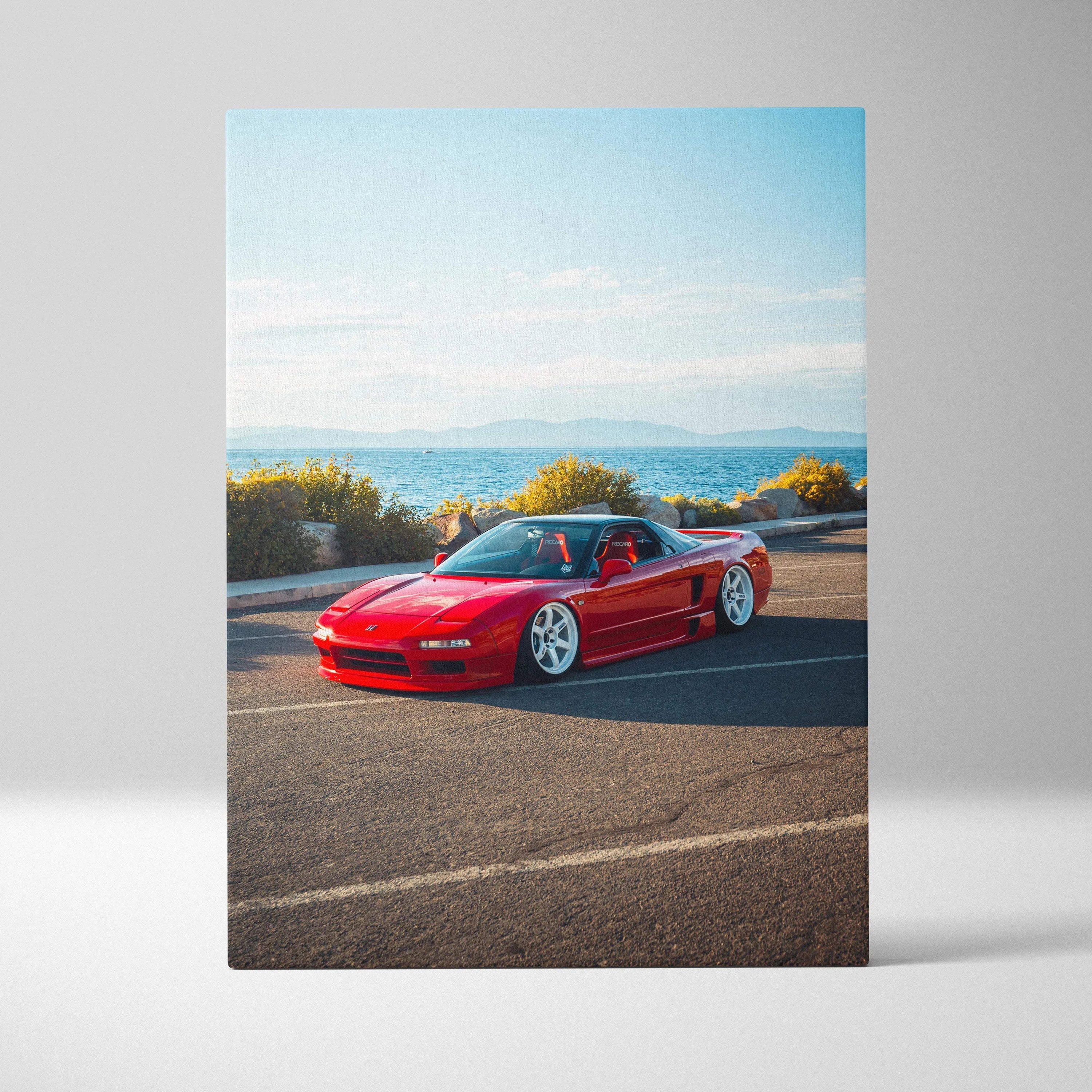 Red Acura NSX sports car on coastal road canvas wall art with blue sky background.