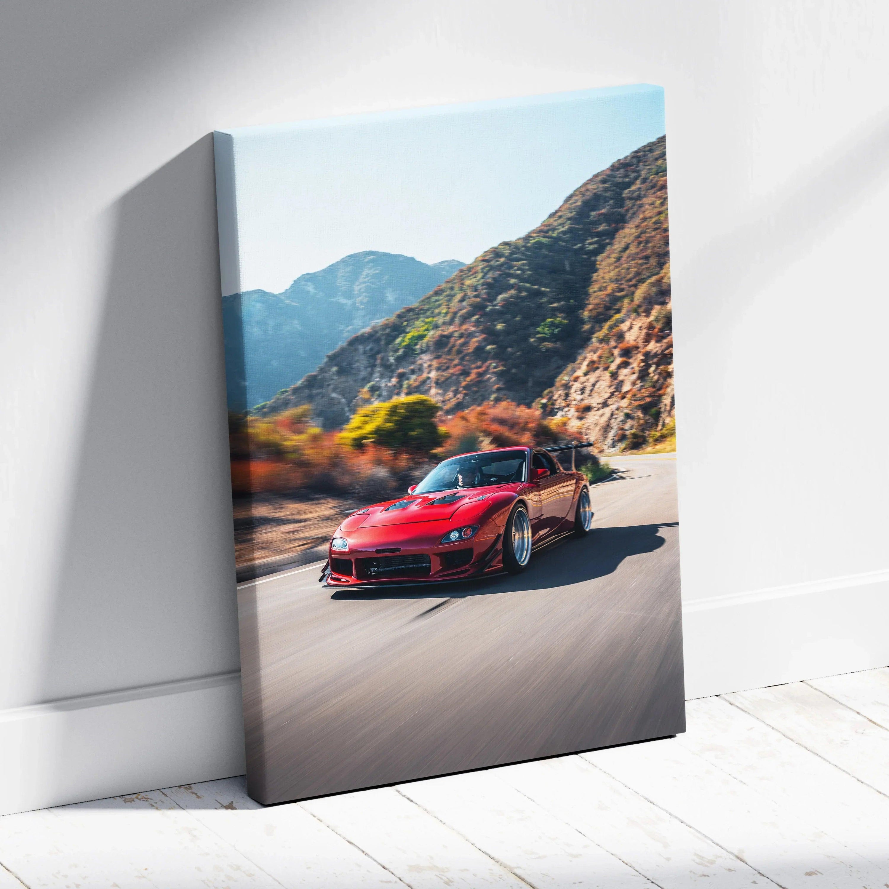 Red Mazda FD RX7 driving on mountain road canvas wall art, vertical canvas print.