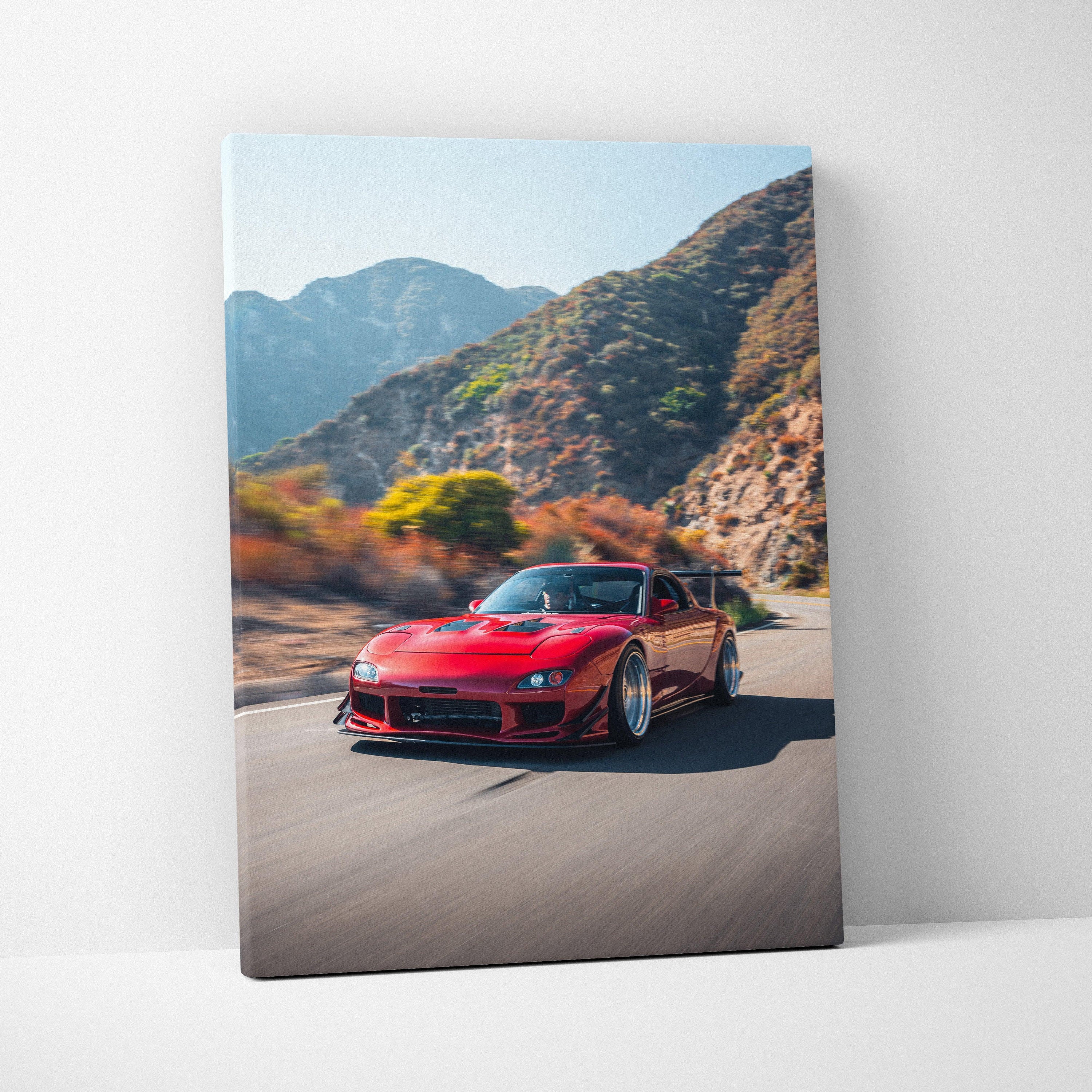 Red Mazda FD RX7 driving on mountain road printed on vertical canvas wall art.