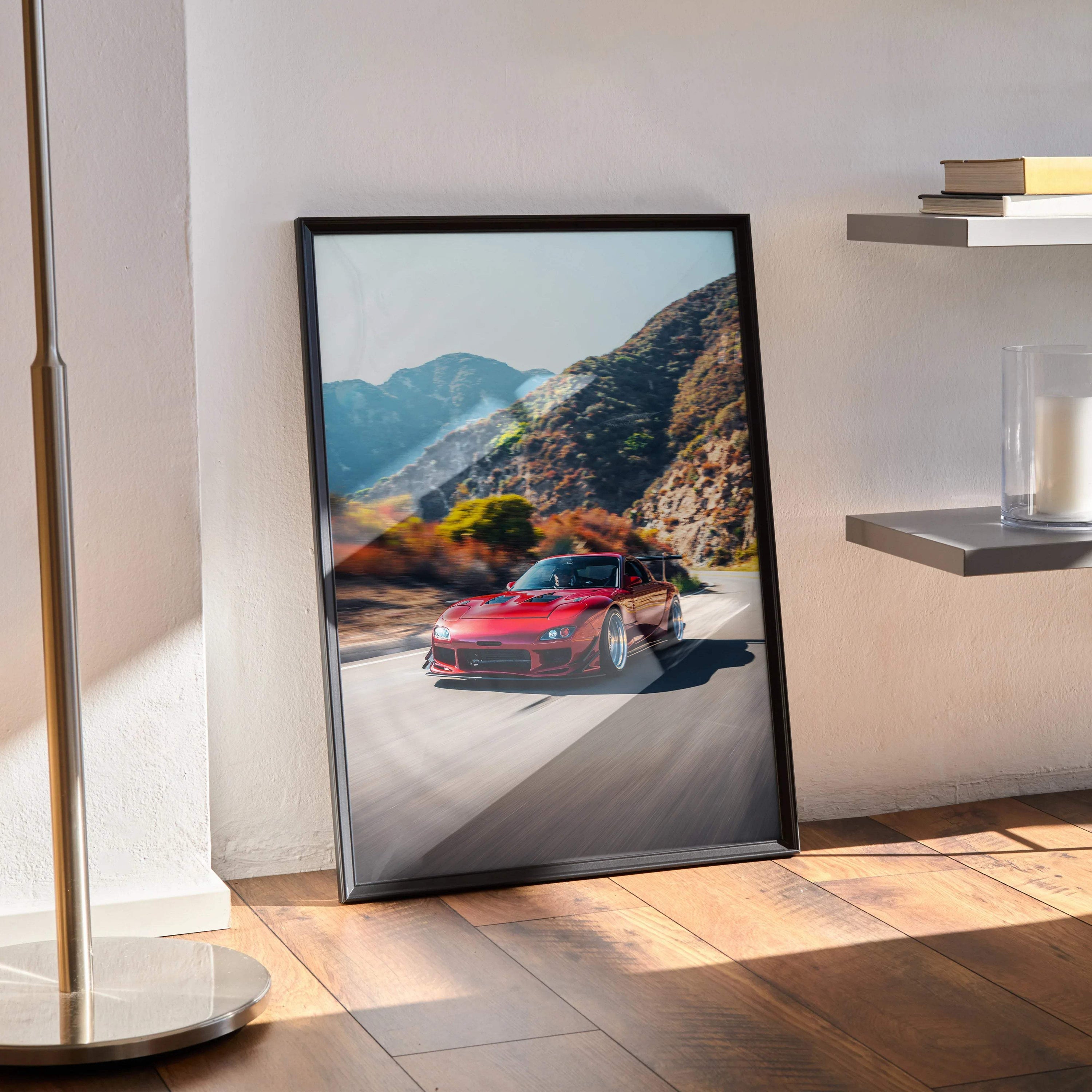 FD RX7 red sports car driving on mountain road poster wall art in black frame.