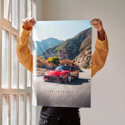 Motivational poster wall art featuring a red Mazda RX7 FD driving on a mountain road with inspiring text "Be Yourself".