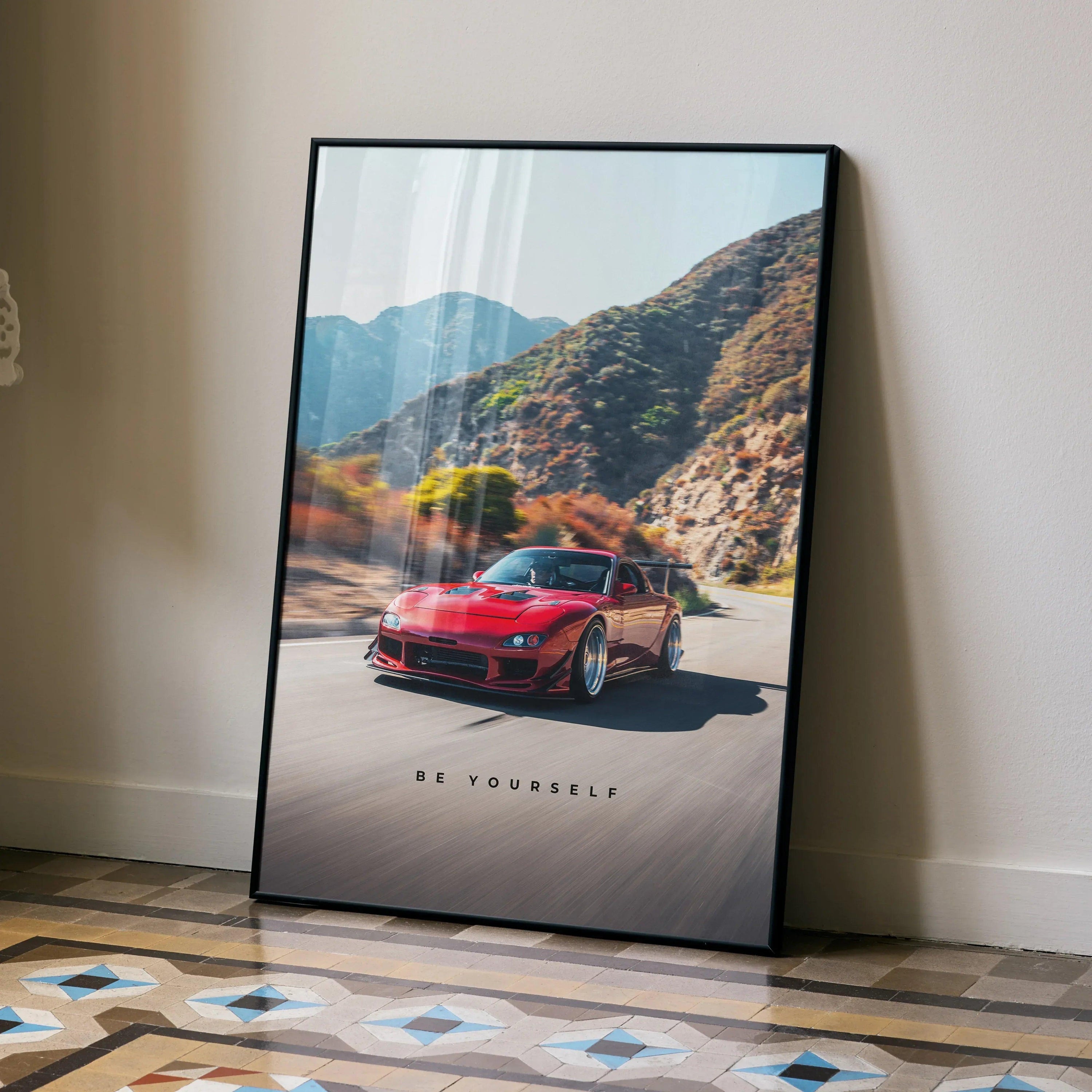 Motivational poster wall art featuring red Mazda RX7 FD driving on mountain road with inspiring text.