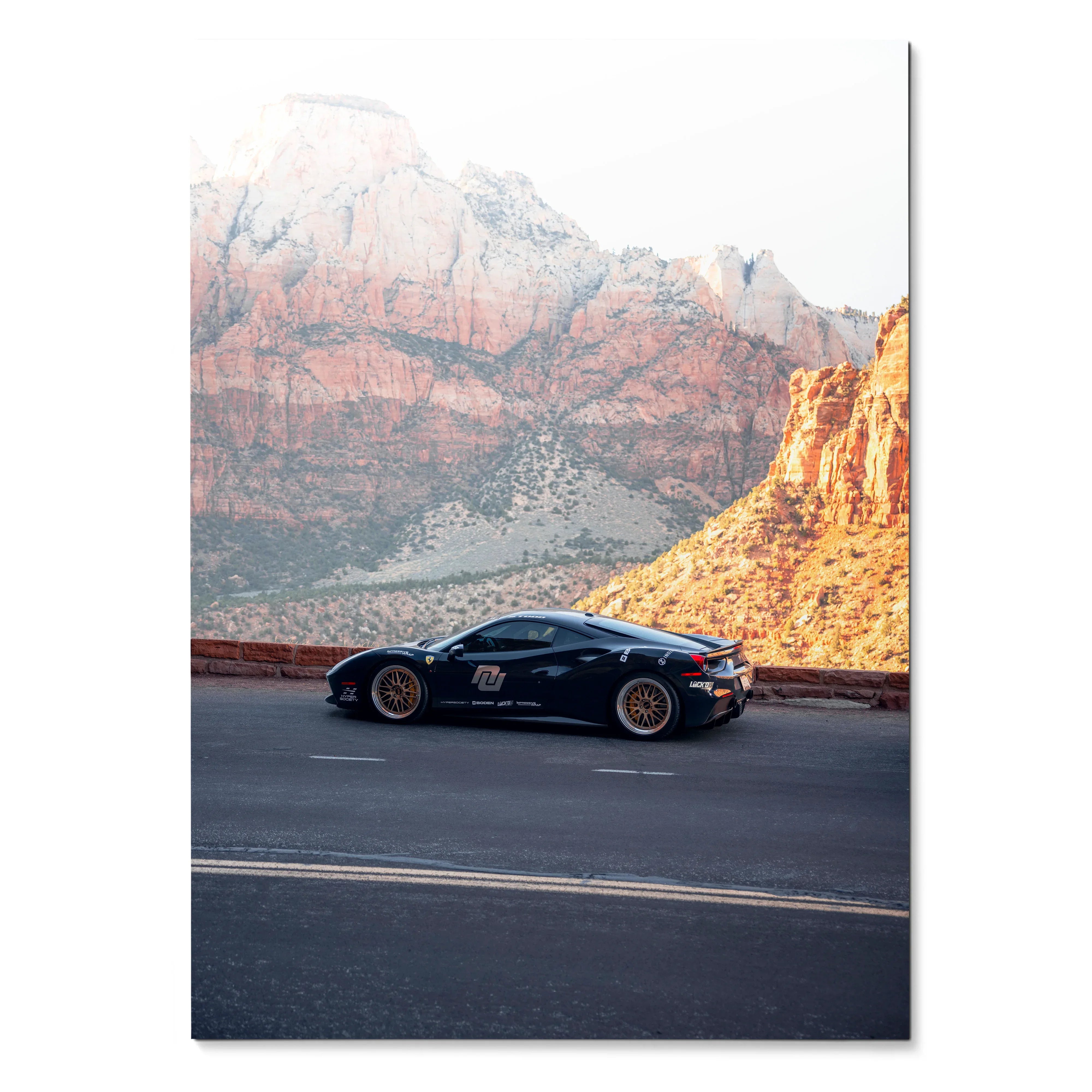 Ferrari 488 GTB black sports car driving on road with rocky mountain backdrop wall art poster.