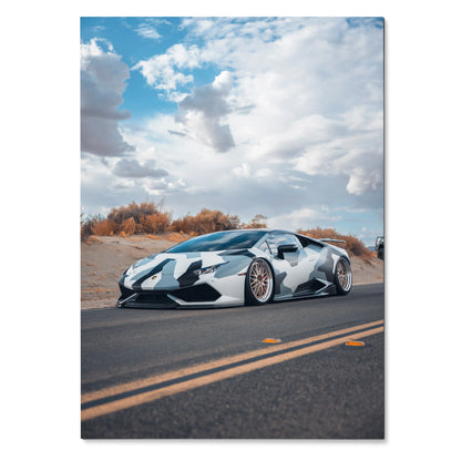 Lamborghini Huracan poster with black and white camo design on desert road wall art.