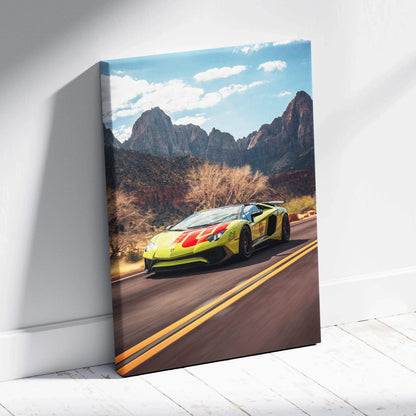 Vertical canvas art of yellow Lamborghini Aventador SVJ driving on desert road with mountains background.