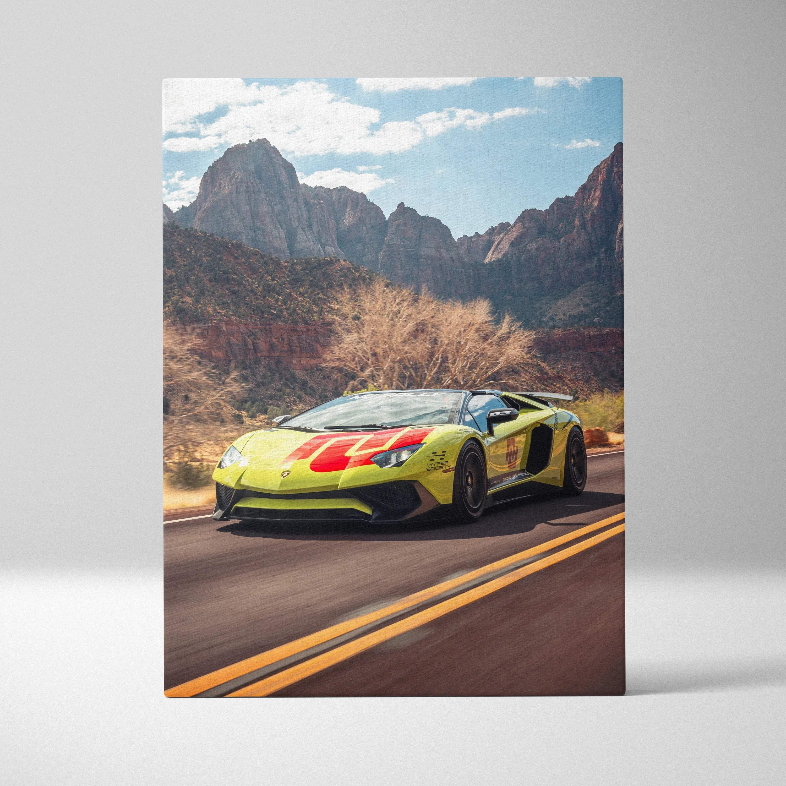 Lamborghini Aventador SVJ driving on desert road canvas wall art with mountains backdrop.