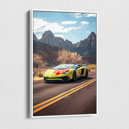 Vertical canvas art of yellow Lamborghini Aventador SVJ on mountain road with blue sky wall art.