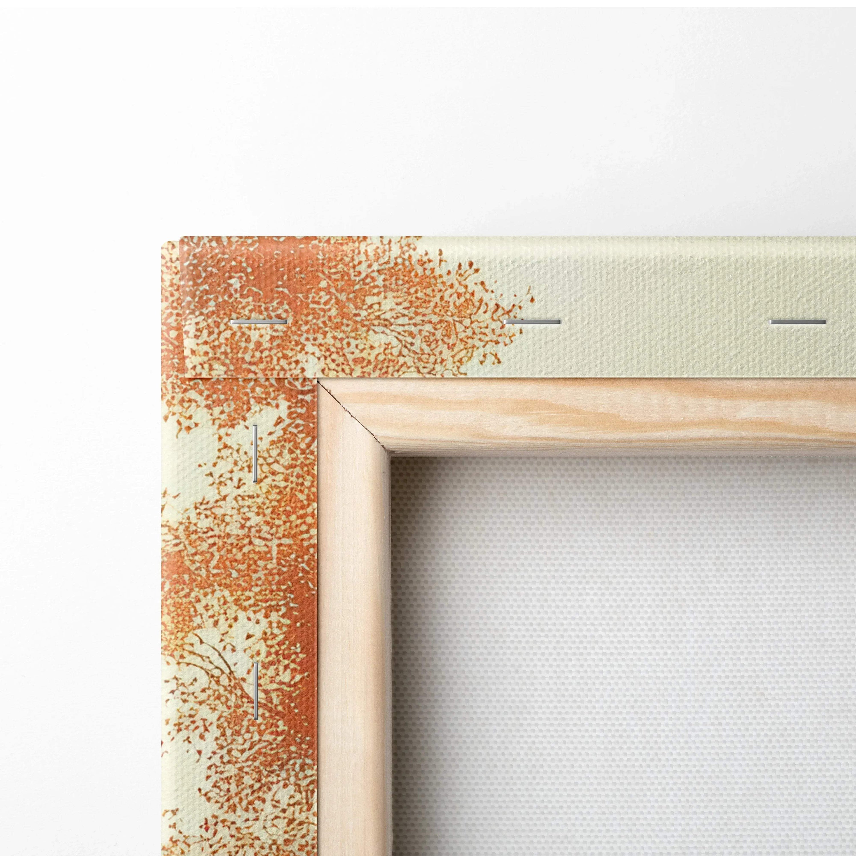Close-up of wooden frame corner on autumn foliage canvas art with warm orange leaves and beige background.