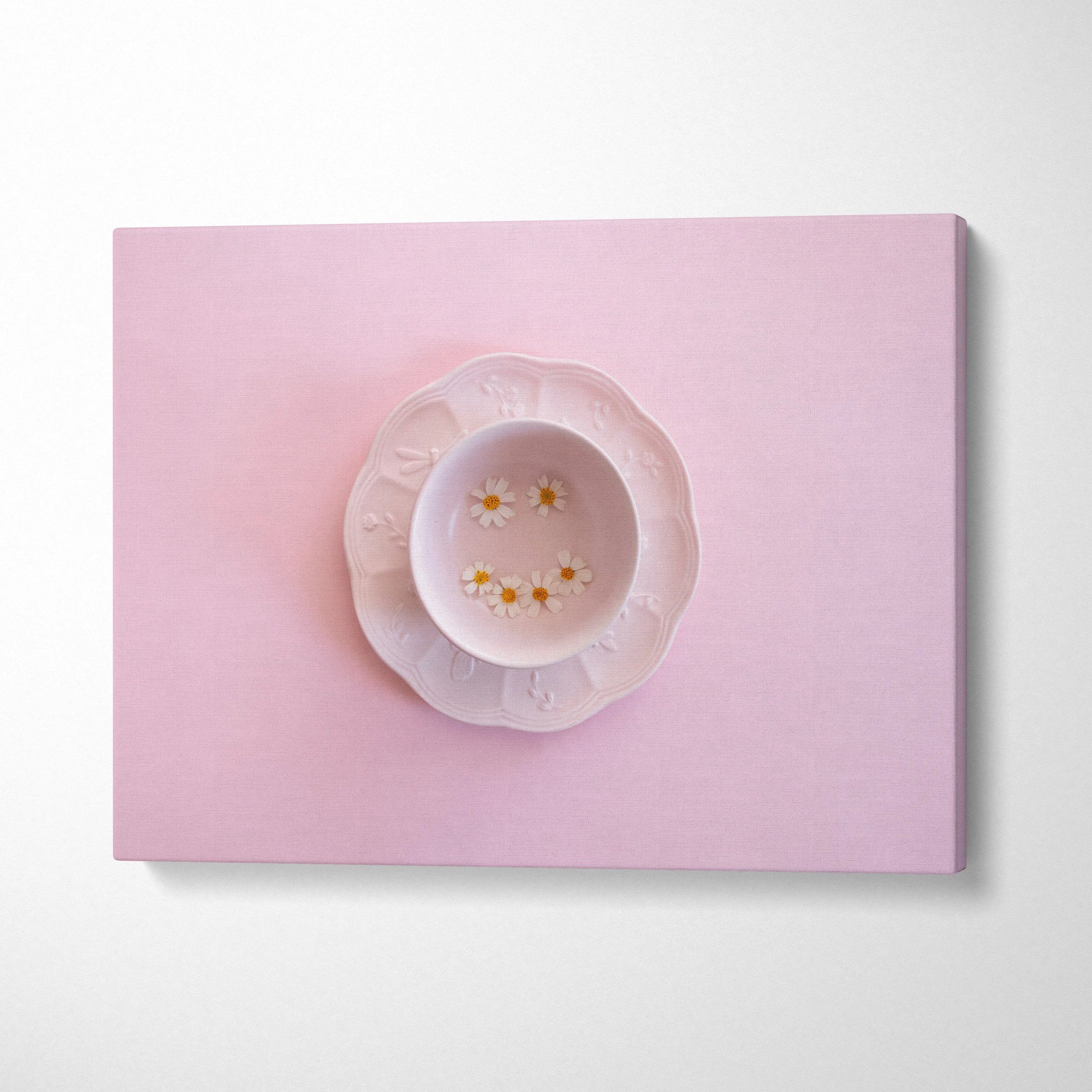 Pink minimalist digital canvas wall art featuring a delicate plate with small flowers for modern decor.