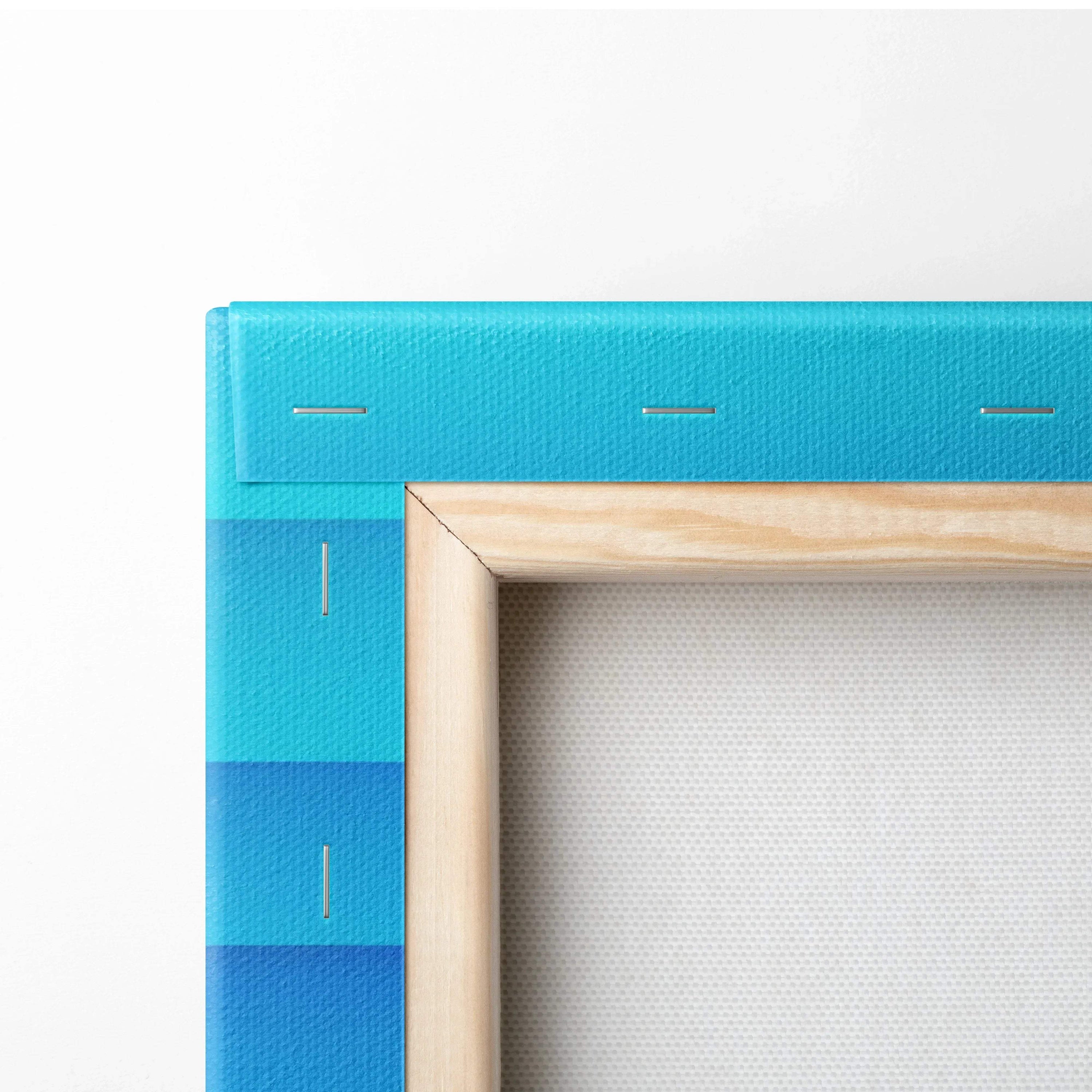 Close-up of stretched blue gradient digital art canvas with natural wood frame for wall art.
