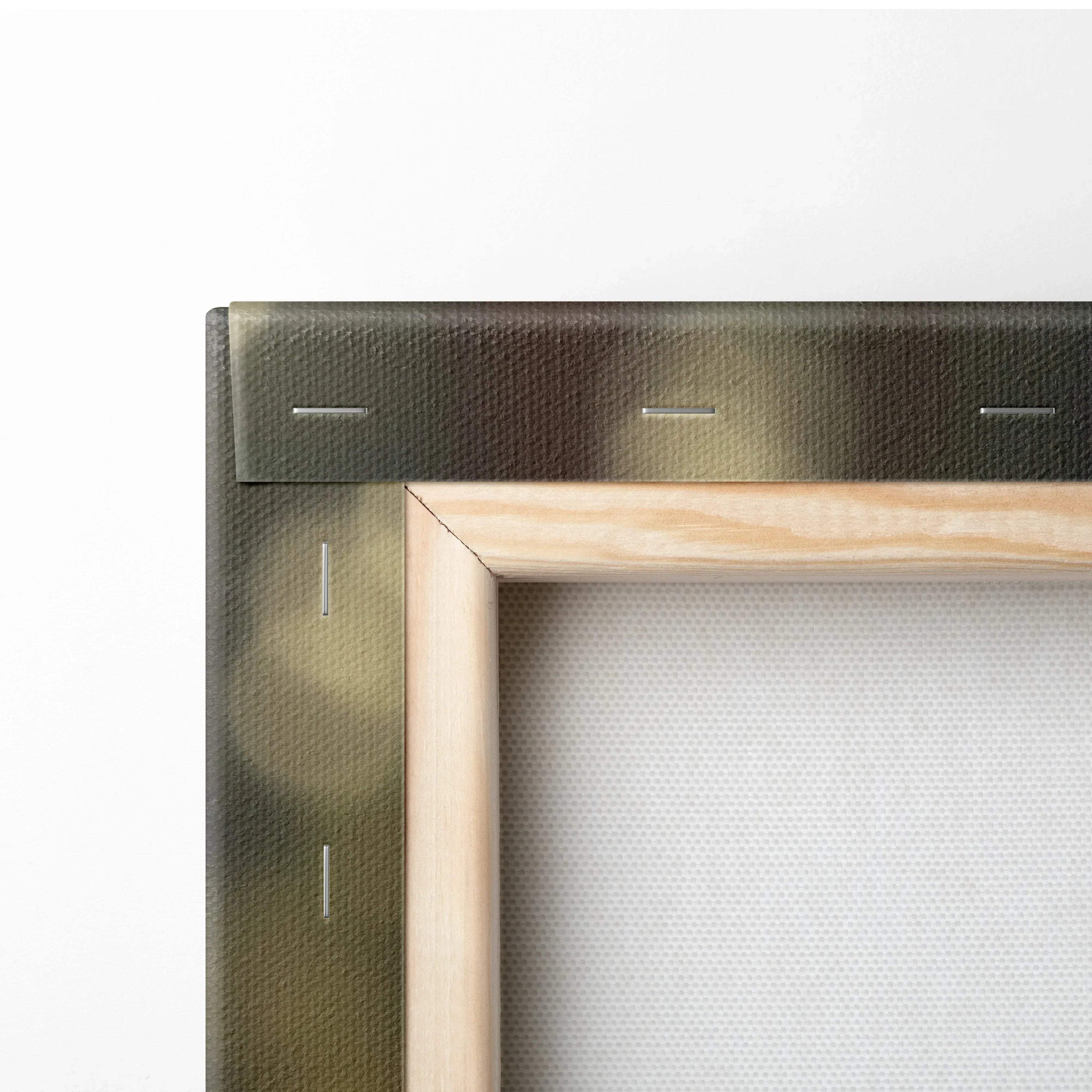 Close-up of canvas stretcher bars with natural wood frame and textured fabric backing in neutral tones.
