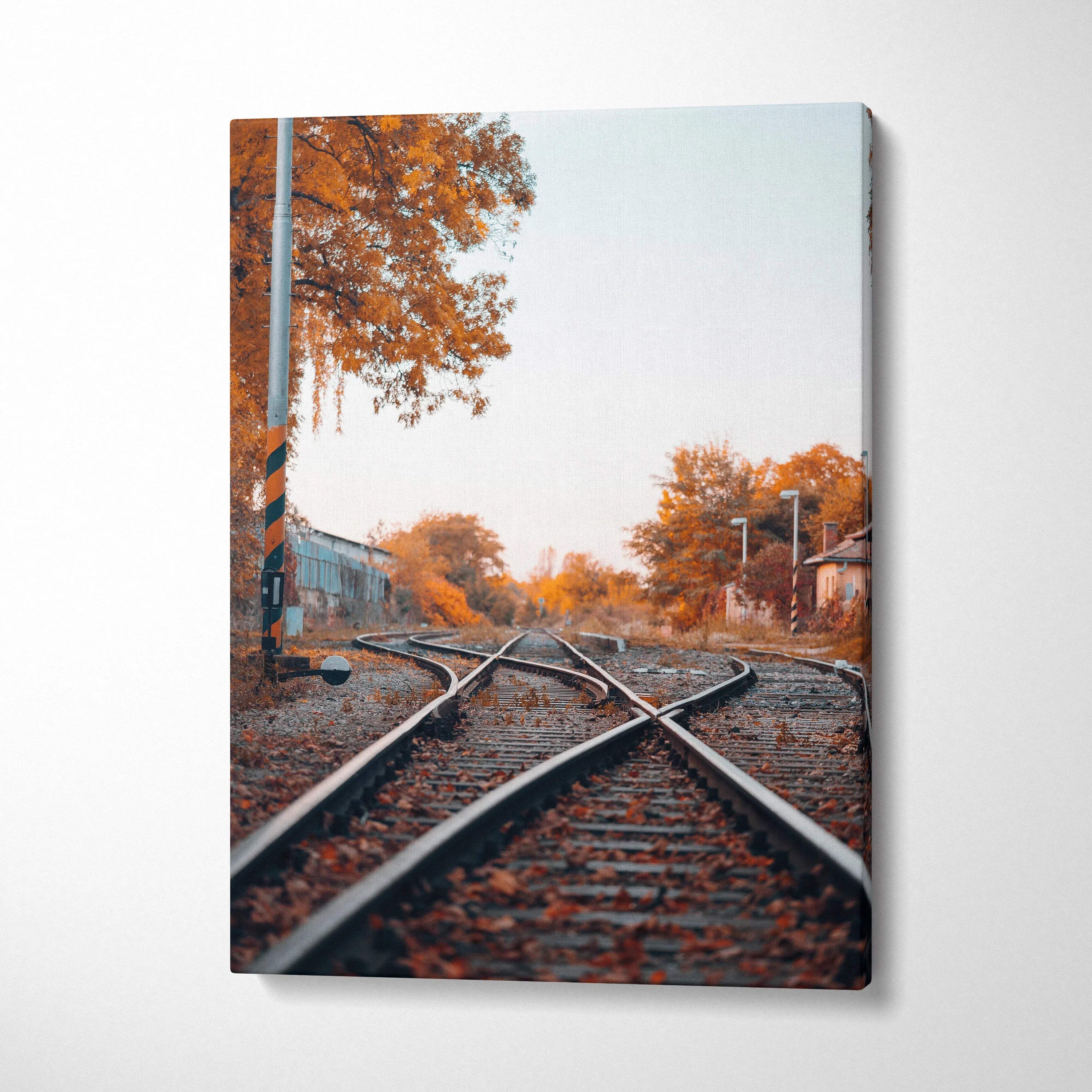 Autumn landscape canvas wall art with railroad tracks and orange foliage.