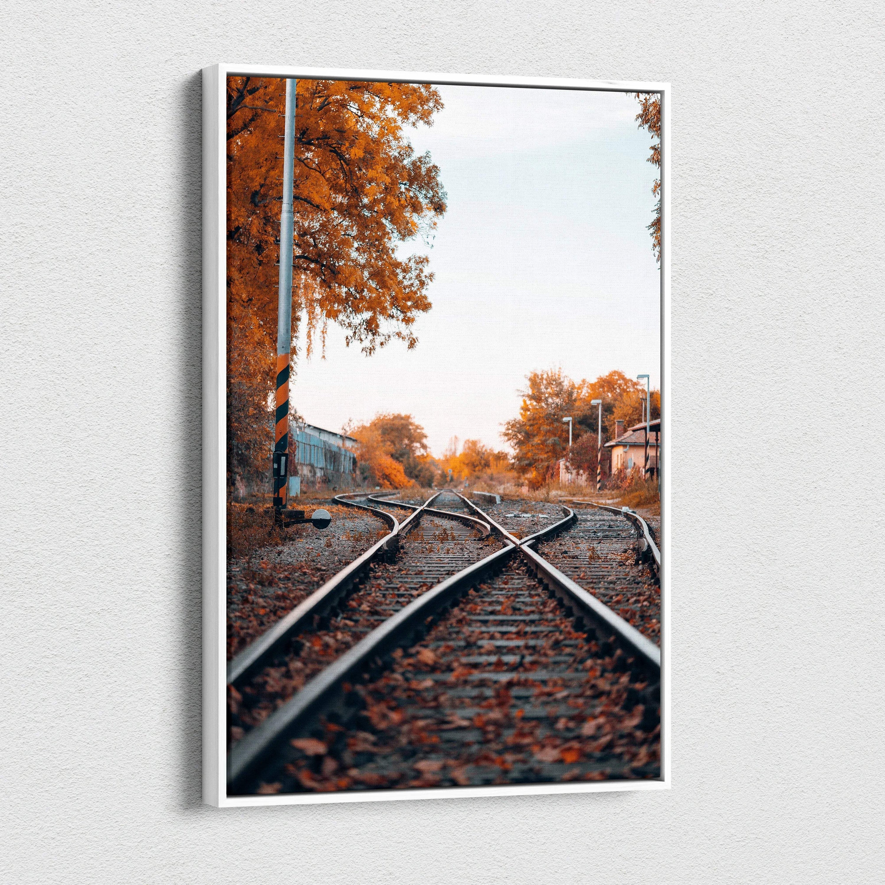 Autumn nature canvas wall art featuring railway tracks with orange foliage and clear sky.