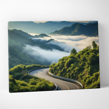 Canvas wall art featuring a winding road through lush green mountains and misty forest landscape decor.