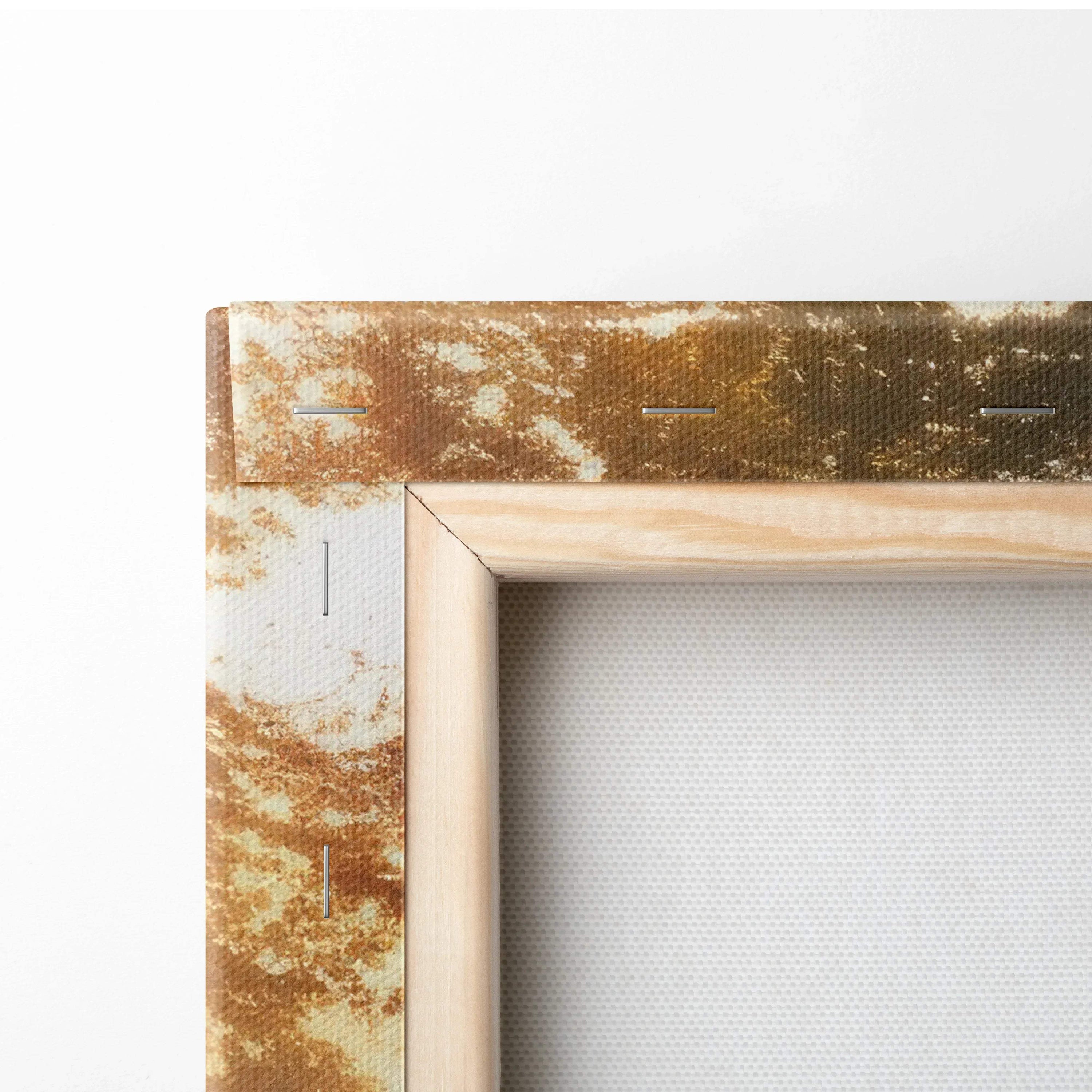Close-up of wooden frame corner with natural wood finish and textured canvas tautly stretched for wall art canvas print.