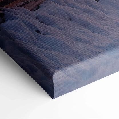 Close-up of snowy winter village digital canvas wall art with textured fabric and vibrant colors.