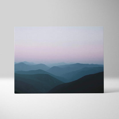Canvas print of foggy morning mountains in soft pink blue gradient sky