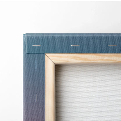 Close-up of a wooden stretcher frame with blue canvas wrapped and stapled around edges for wall art decor.