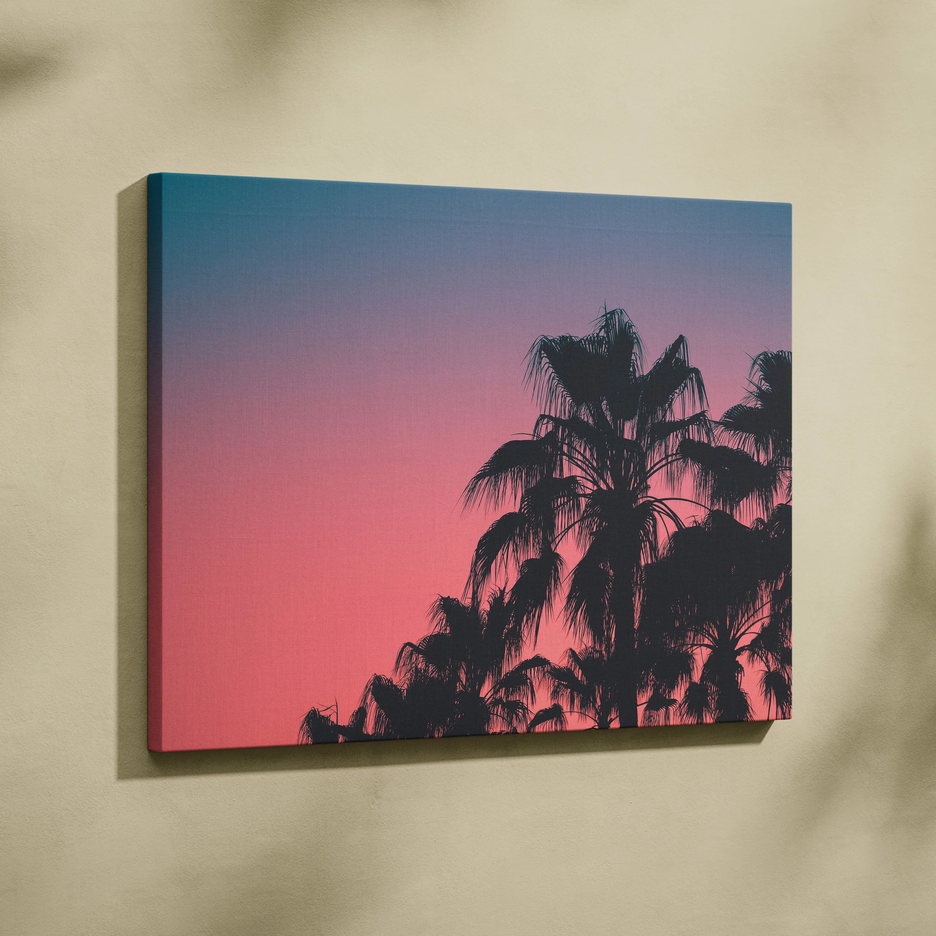 Canvas wall art featuring black palm tree silhouettes against a vibrant pink and blue dusk sky.
