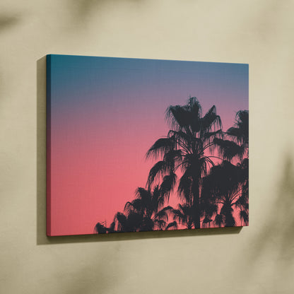 Canvas wall art featuring black palm tree silhouettes against a vibrant pink and blue dusk sky.