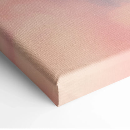 Close-up of canvas wall art with soft pink and beige gradient, textured minimalist surface.