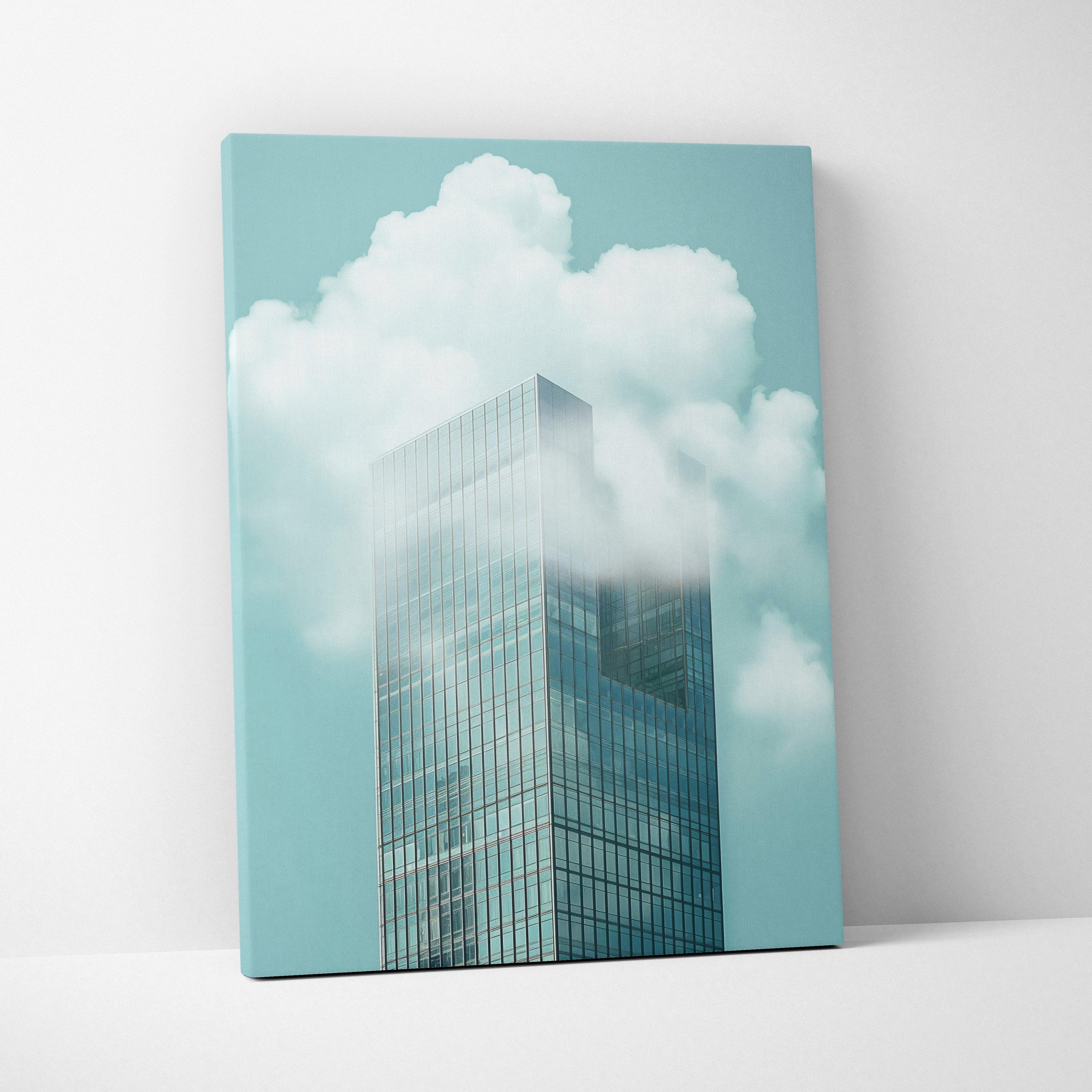 Canvas wall art featuring a minimalist skyscraper with reflective glass against a soft blue sky with white clouds.