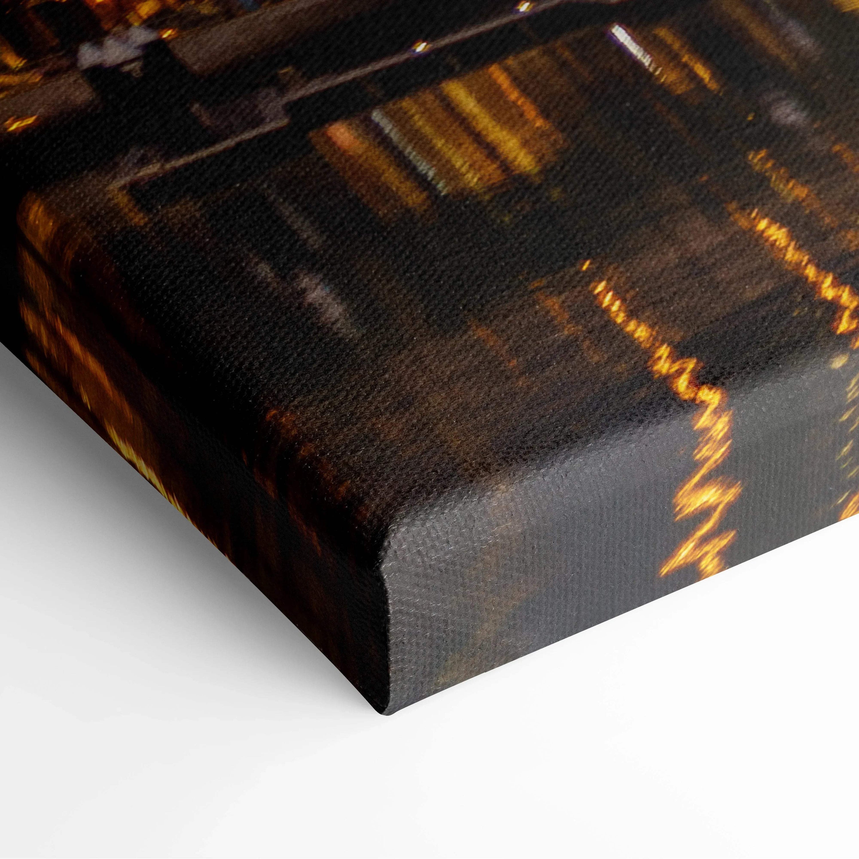 Dark-toned canvas wall art print with abstract golden light streaks and texture on the surface.