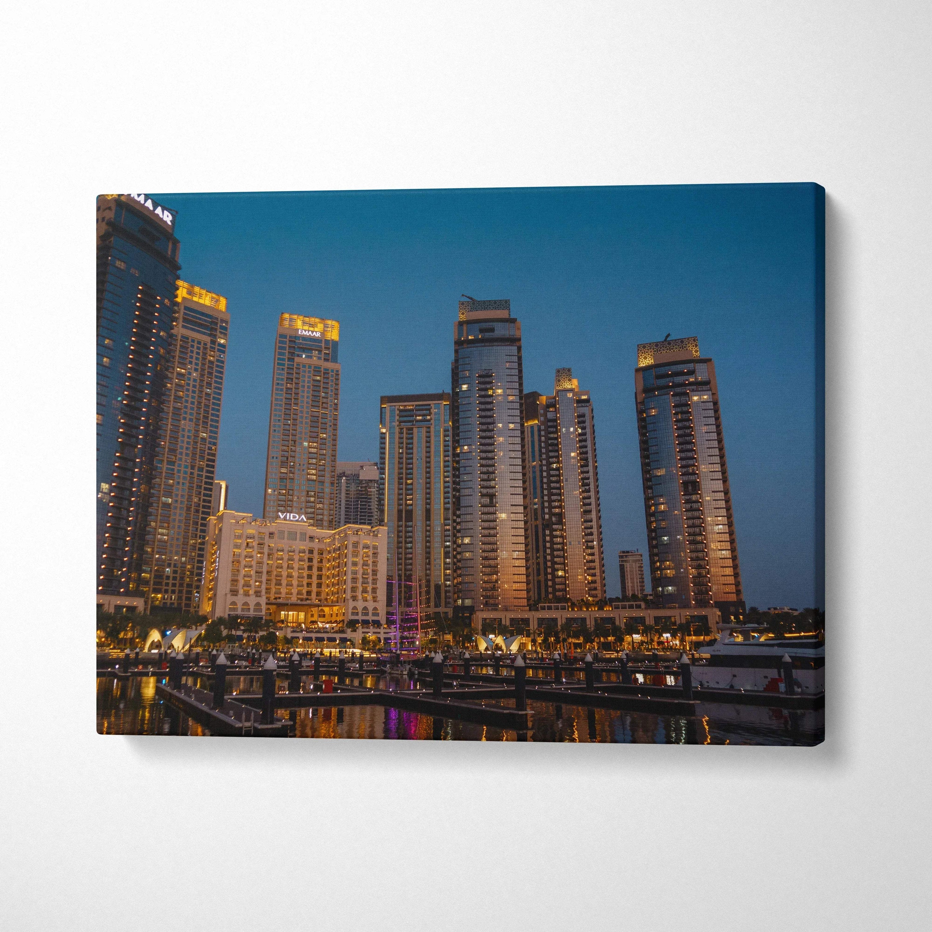 City skyline at dusk with illuminated high-rise buildings on canvas wall art print.