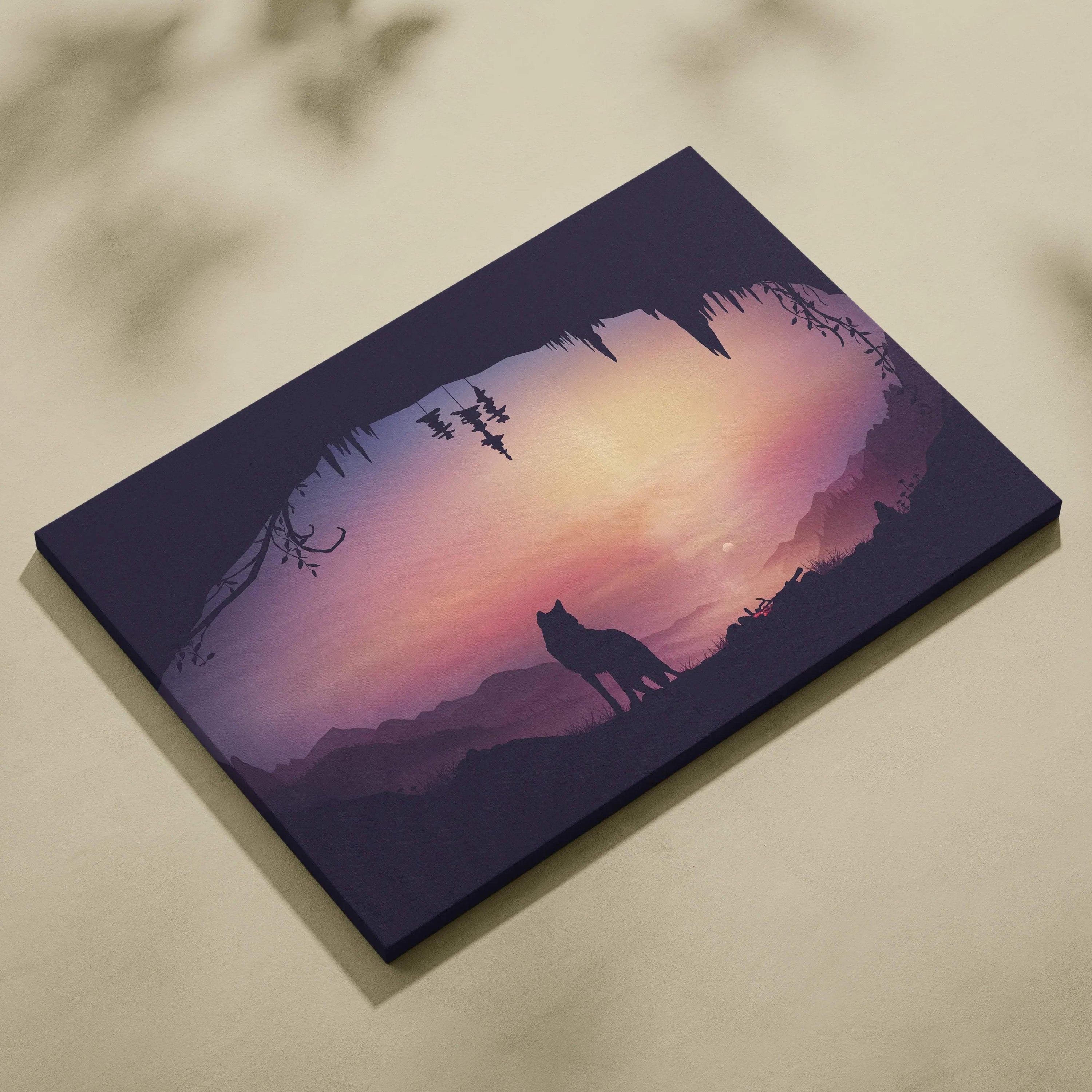 Minimalist wolf silhouette in cave at dusk over mauve pink horizon canvas print