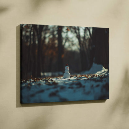 Canvas wall art featuring a small snowman in a snowy forest with soft natural light and muted colors.