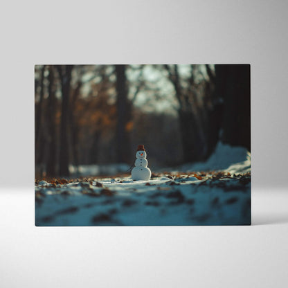 Canvas wall art featuring a small snowman in a snowy forest with soft, warm lighting and blurred trees in the background.