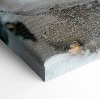 Canvas wall art print featuring a snowy winter village inside a snow globe with a soft sunset background and digital art.