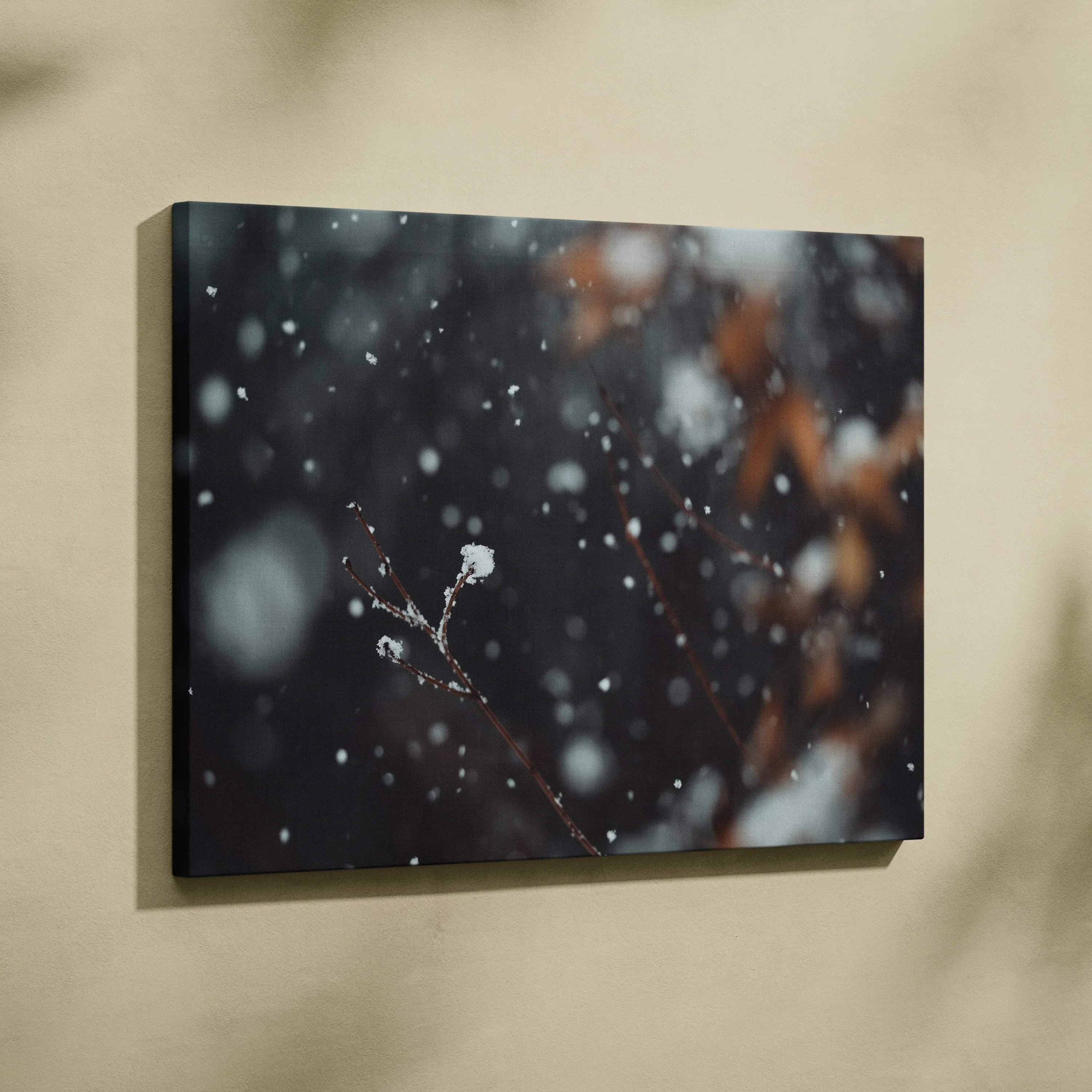 Canvas wall art featuring a dark winter landscape with snowflakes falling softly on delicate branches, accented with subtle.