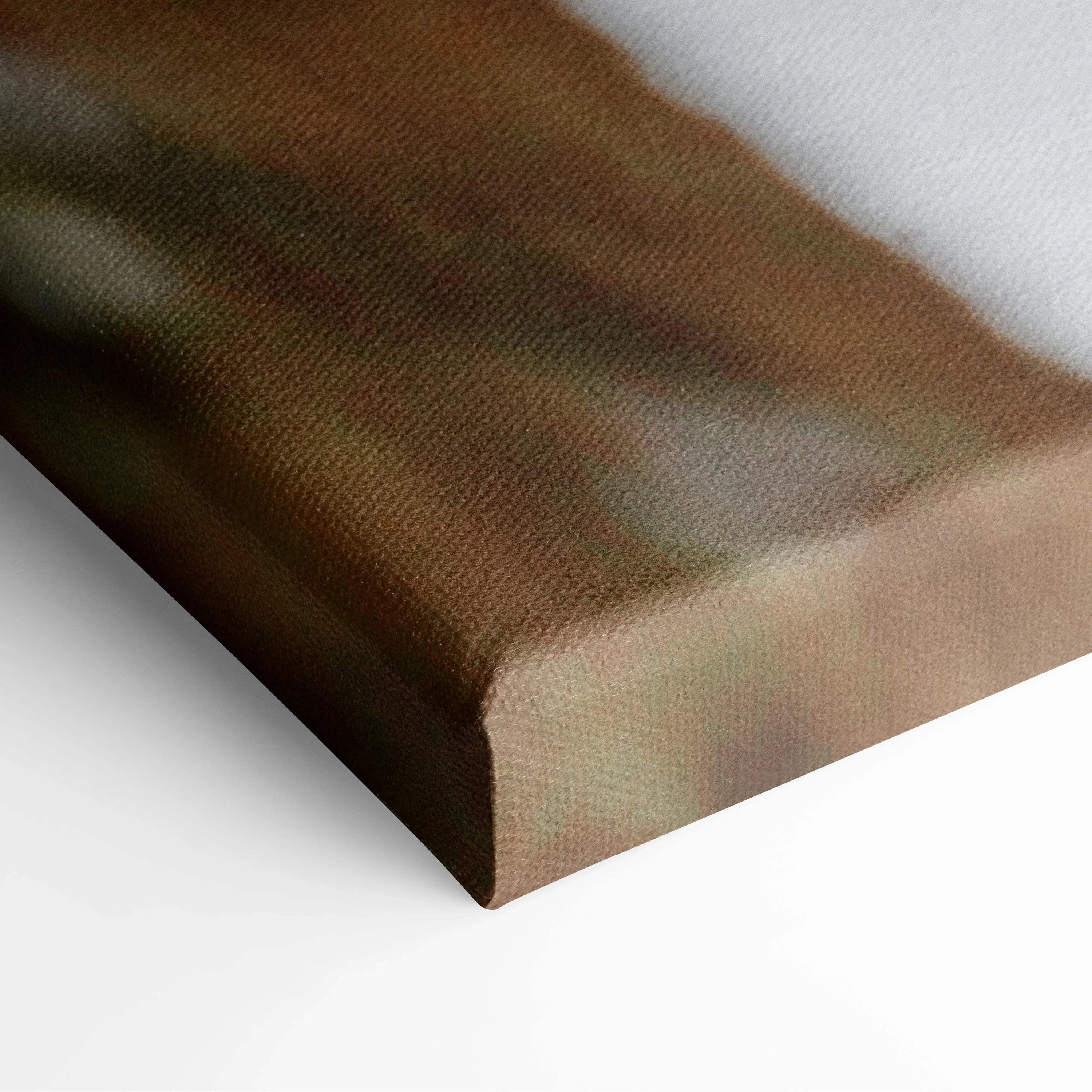 Close-up of textured canvas edge with muted brown and green tones in wall art decor.