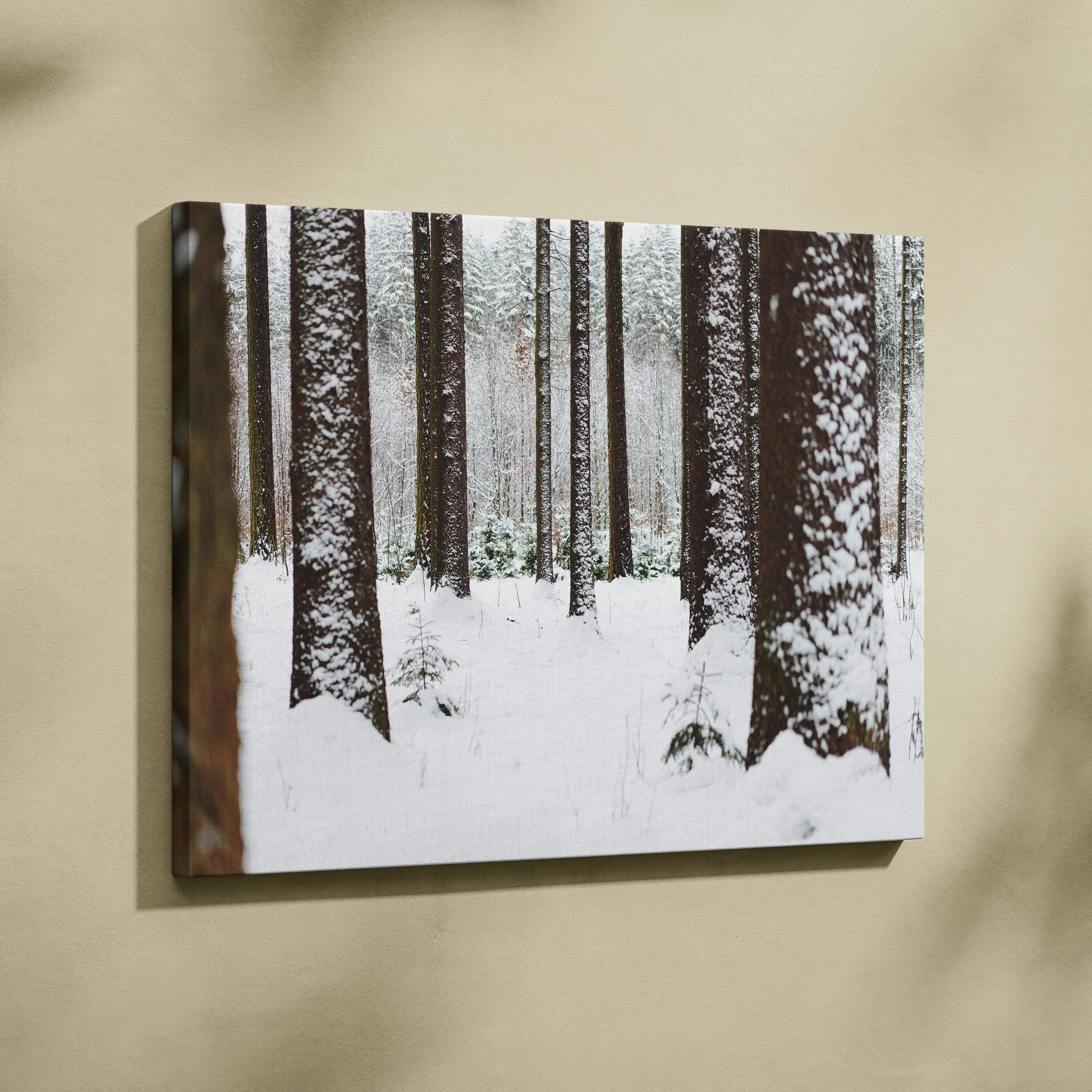 Snowy forest landscape canvas wall art with tall trees and white winter decor.
