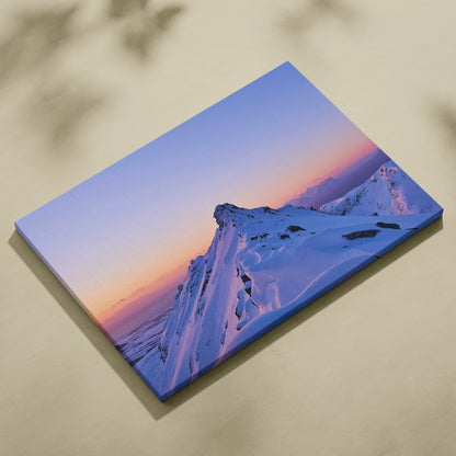 Canvas wall art showcasing a snowy mountain peak at sunset with soft pastel sky hues.
