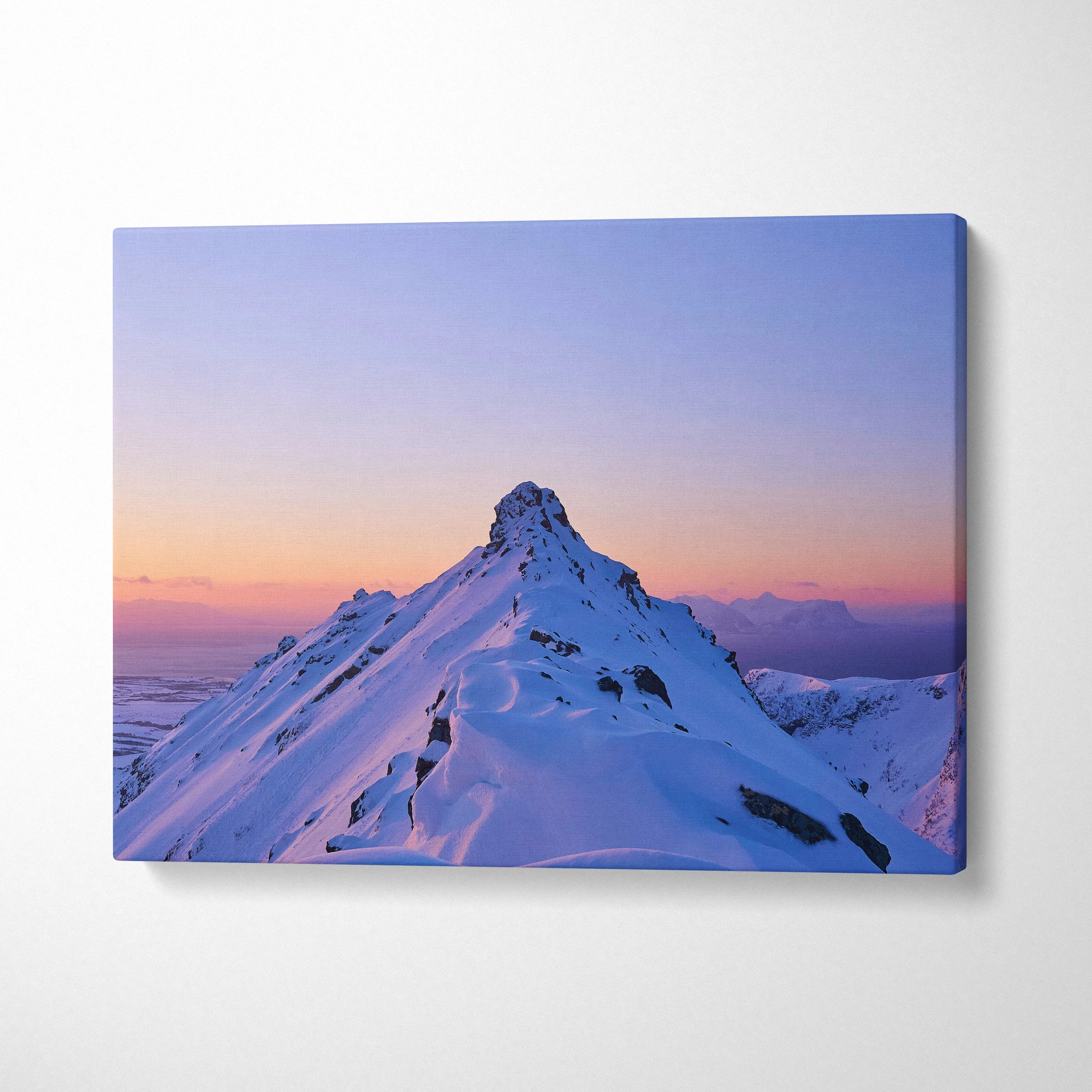 Canvas wall art of a snowy mountain peak at sunset with vibrant purple and orange sky decor.