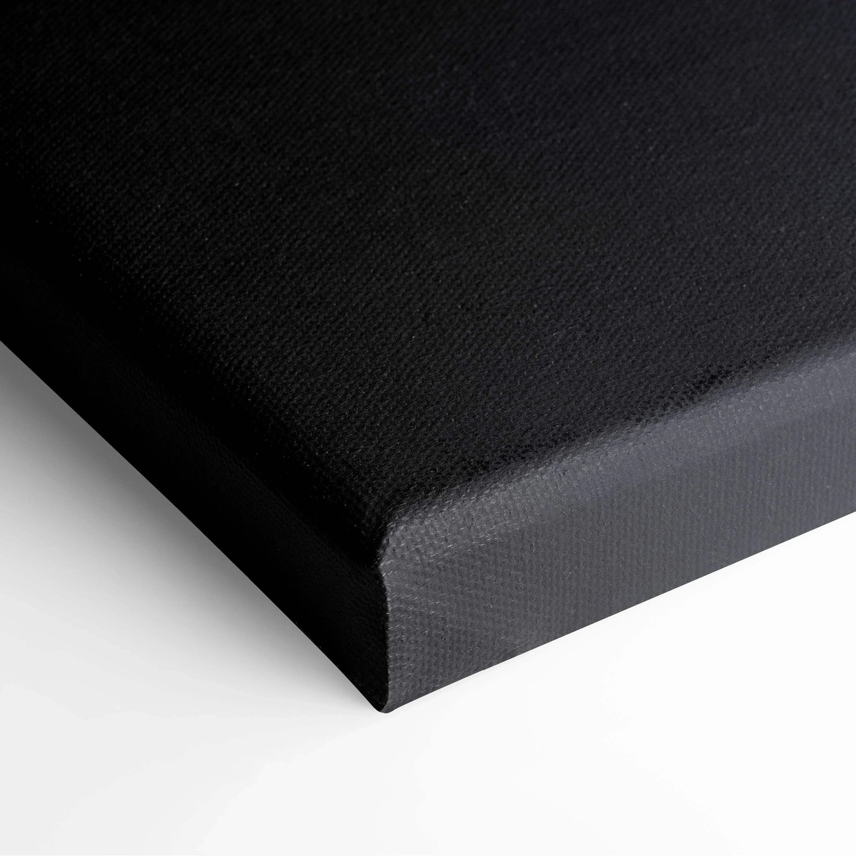 Black edge close-up of stretched canvas wall art with textured surface.