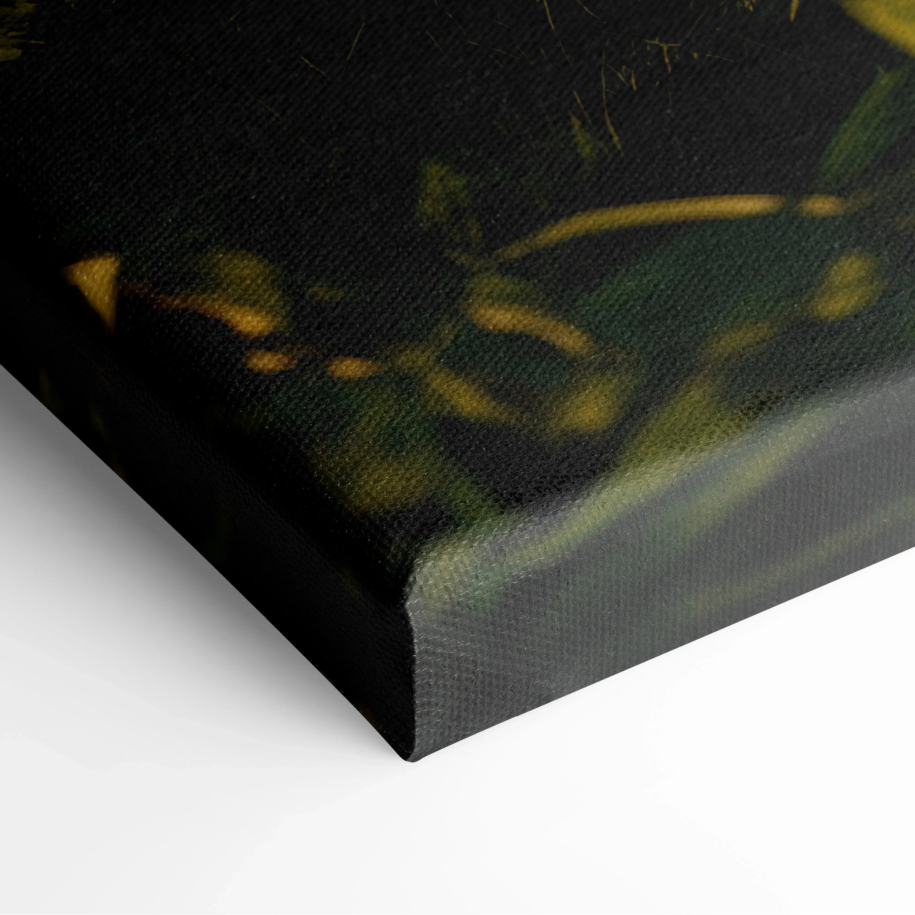 Close-up of black-edged canvas wall art with nature-inspired forest and sunset design decor.
