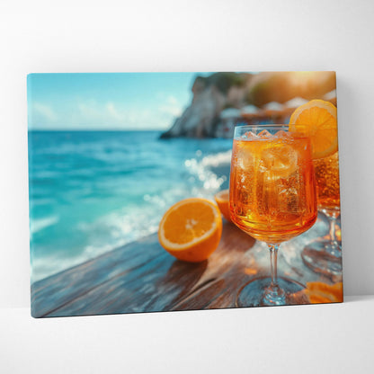 Canvas wall art depicting a vibrant orange Aperol spritz cocktail with ice and an orange slice, set against a bright blue.